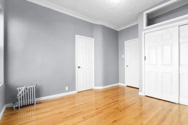 a living room with furniture potted plant and a window