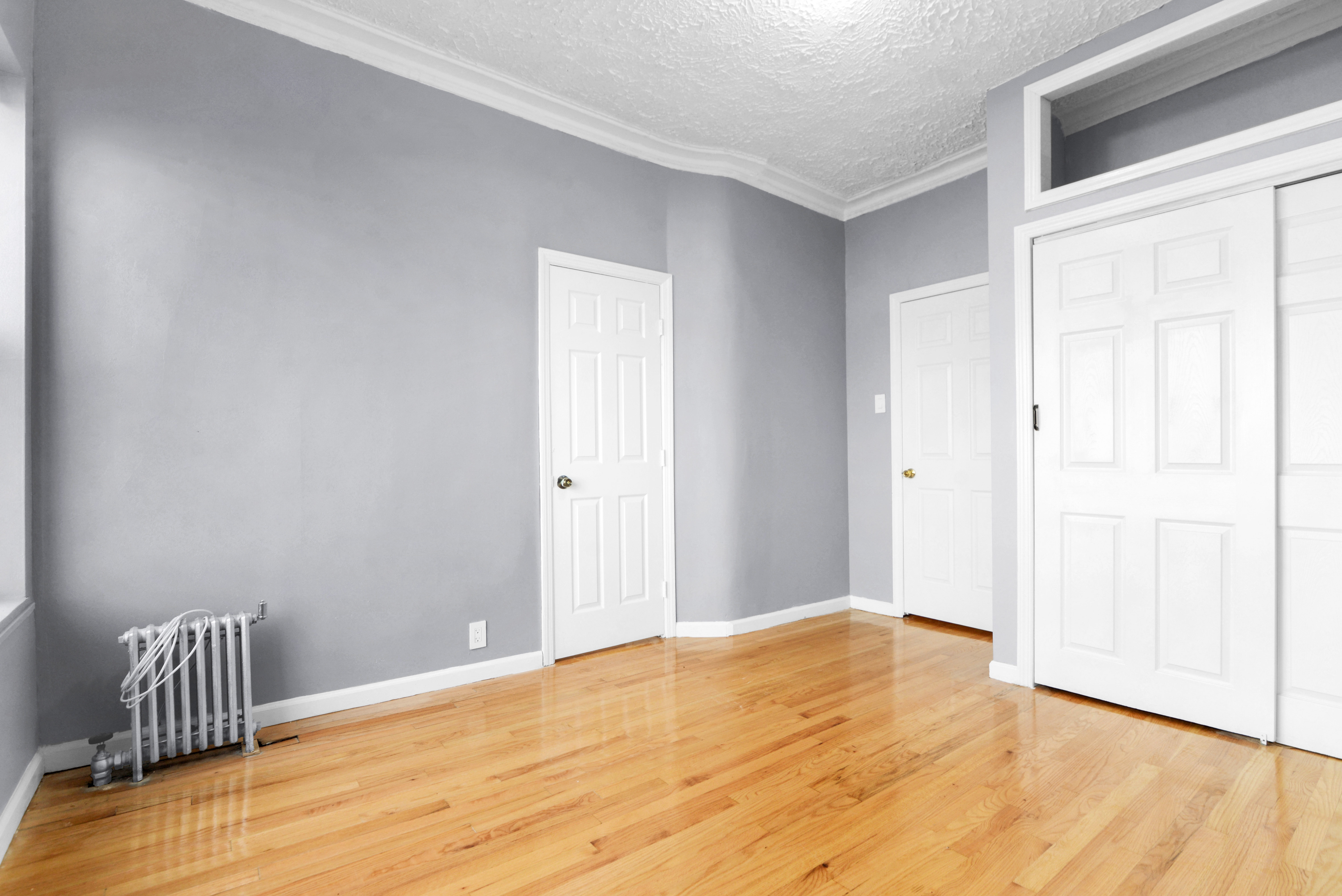 2302 Bedford Avenue, Unit 3 Brooklyn, NY 11226 - Photo 9 of 25 a view of an empty room with wooden floor
