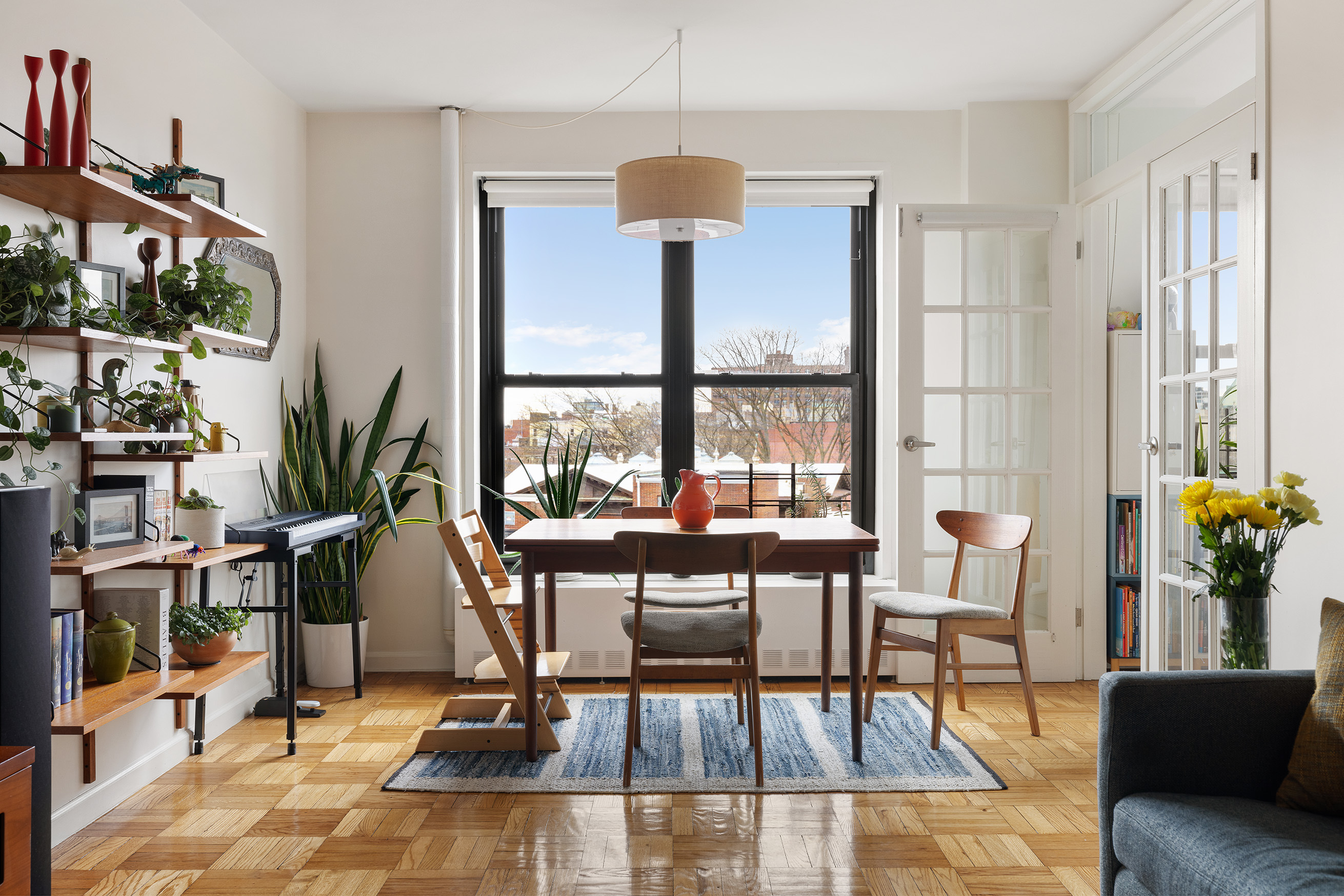 210 Clinton Avenue, Unit 8B Brooklyn, NY 11205 - Photo 3 of 8 a living room with furniture and a potted plant