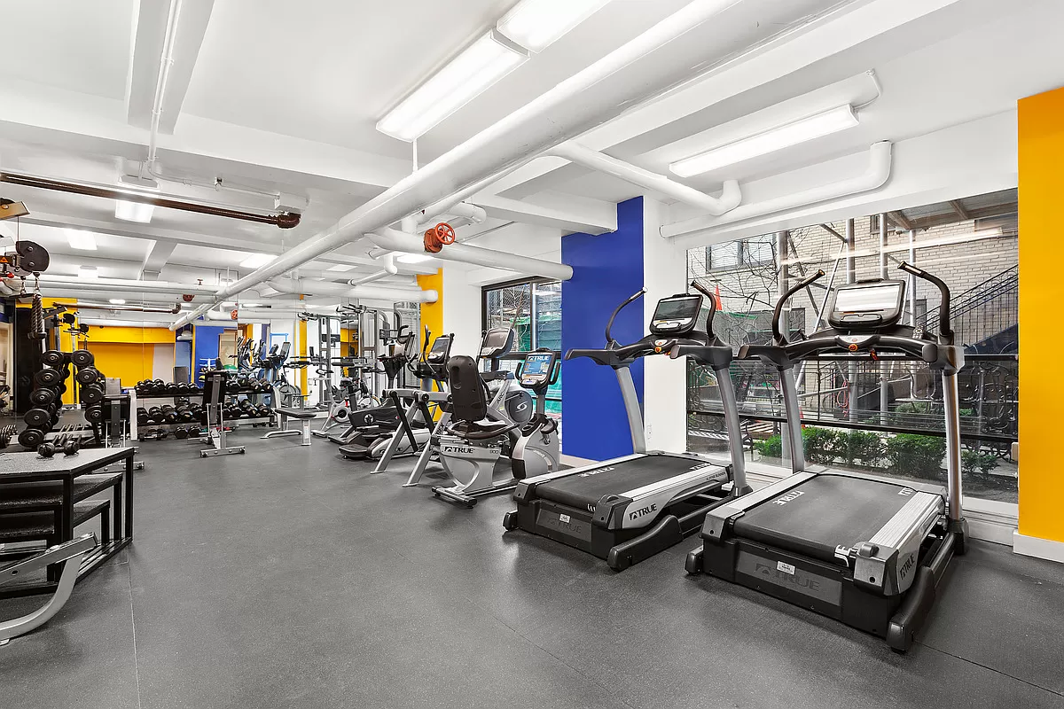230 Riverside Drive, Unit 17D Manhattan, NY 10025 - Photo 12 of 18 a room with gym equipment
