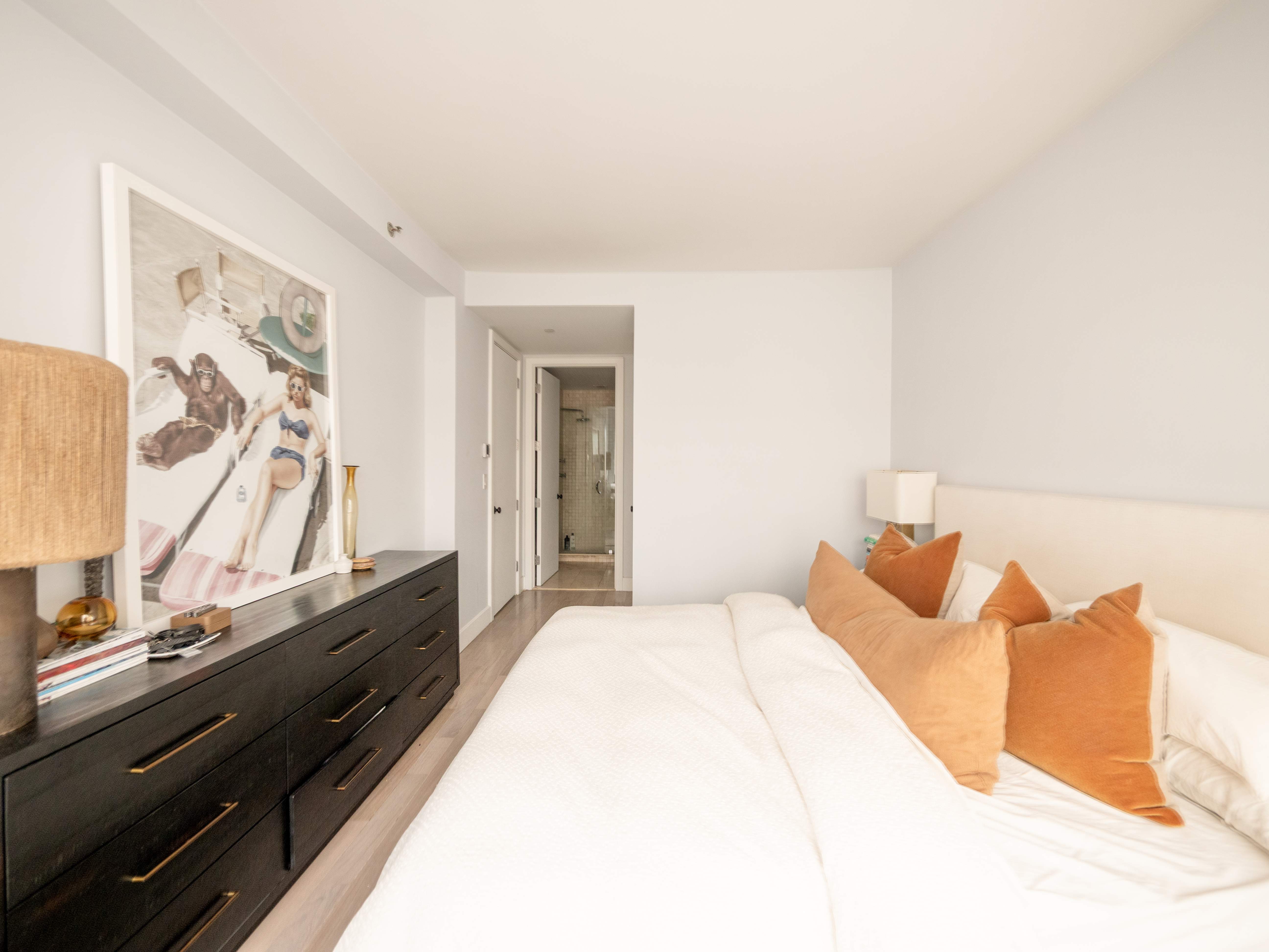 84 Front Street, Unit 5E Brooklyn, NY 11201 - Photo 4 of 11 a bedroom with a bed and a night stand