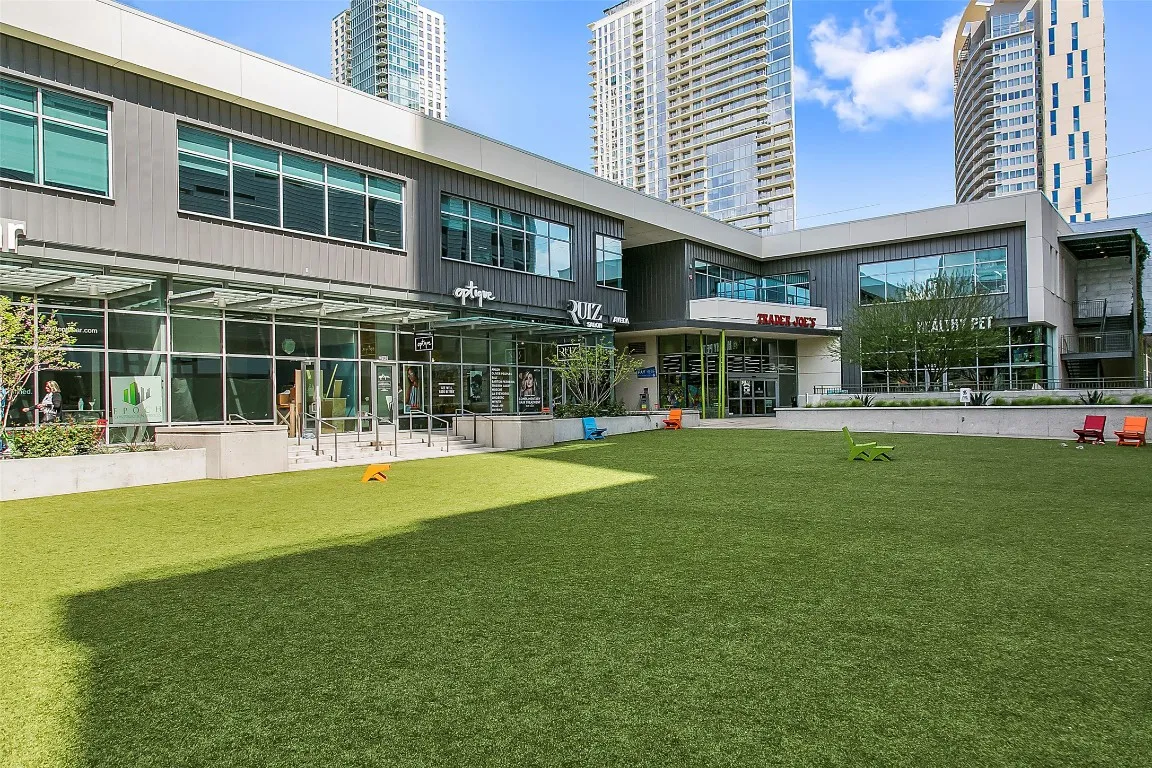 a front view of a building with a garden