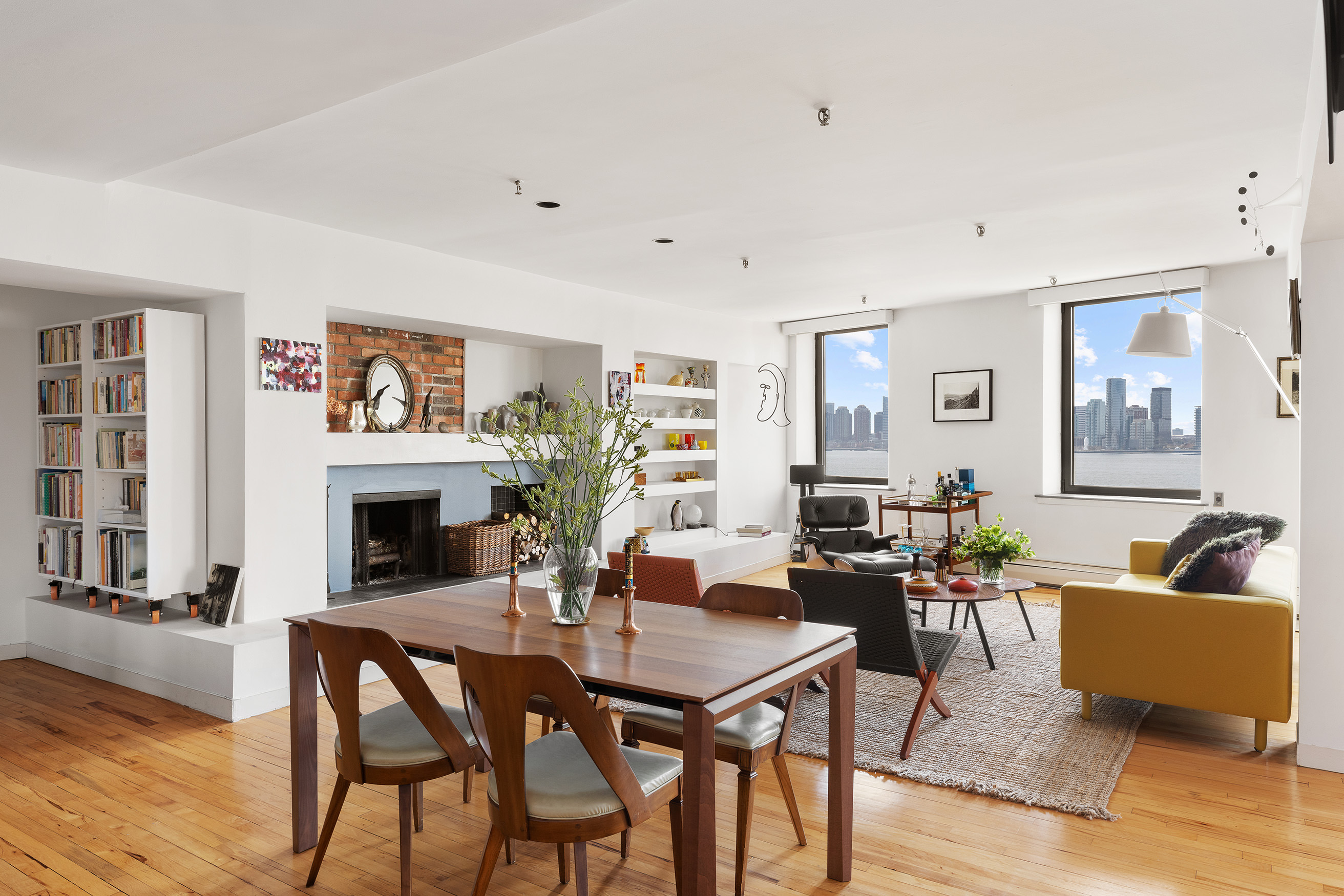166 Bank Street, Unit 6B Manhattan, NY 10014 - Photo 5 of 16 a living room with furniture and a fireplace