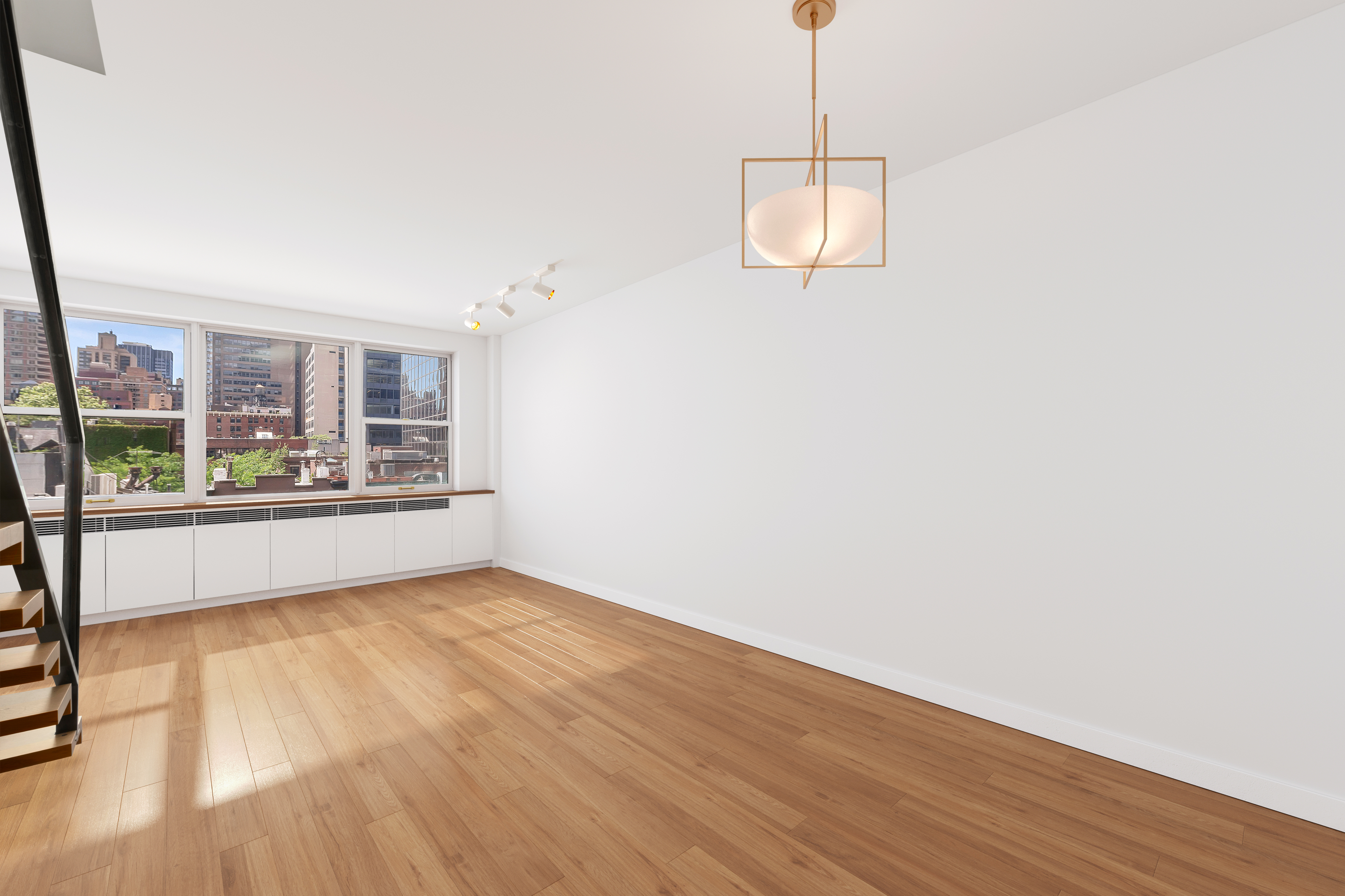 221 East 50th Street, Unit 6D/7D Manhattan, NY 10022 - Photo 6 of 19 a view of an empty room with wooden floor and a window