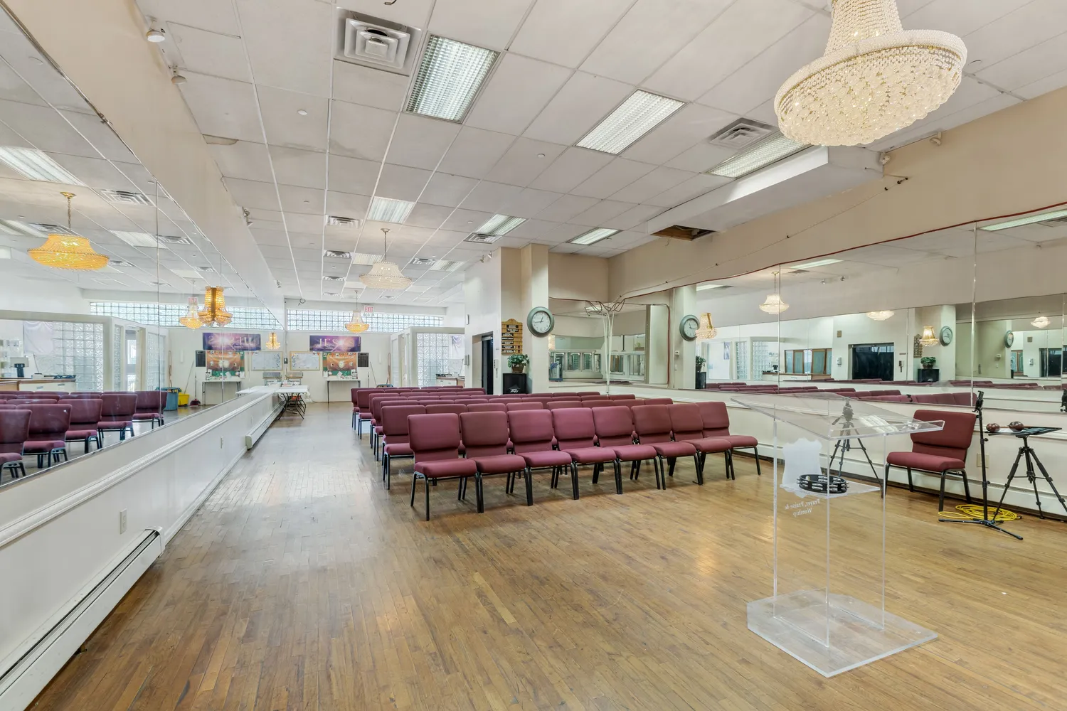a living room with lots of furniture and a wooden floor