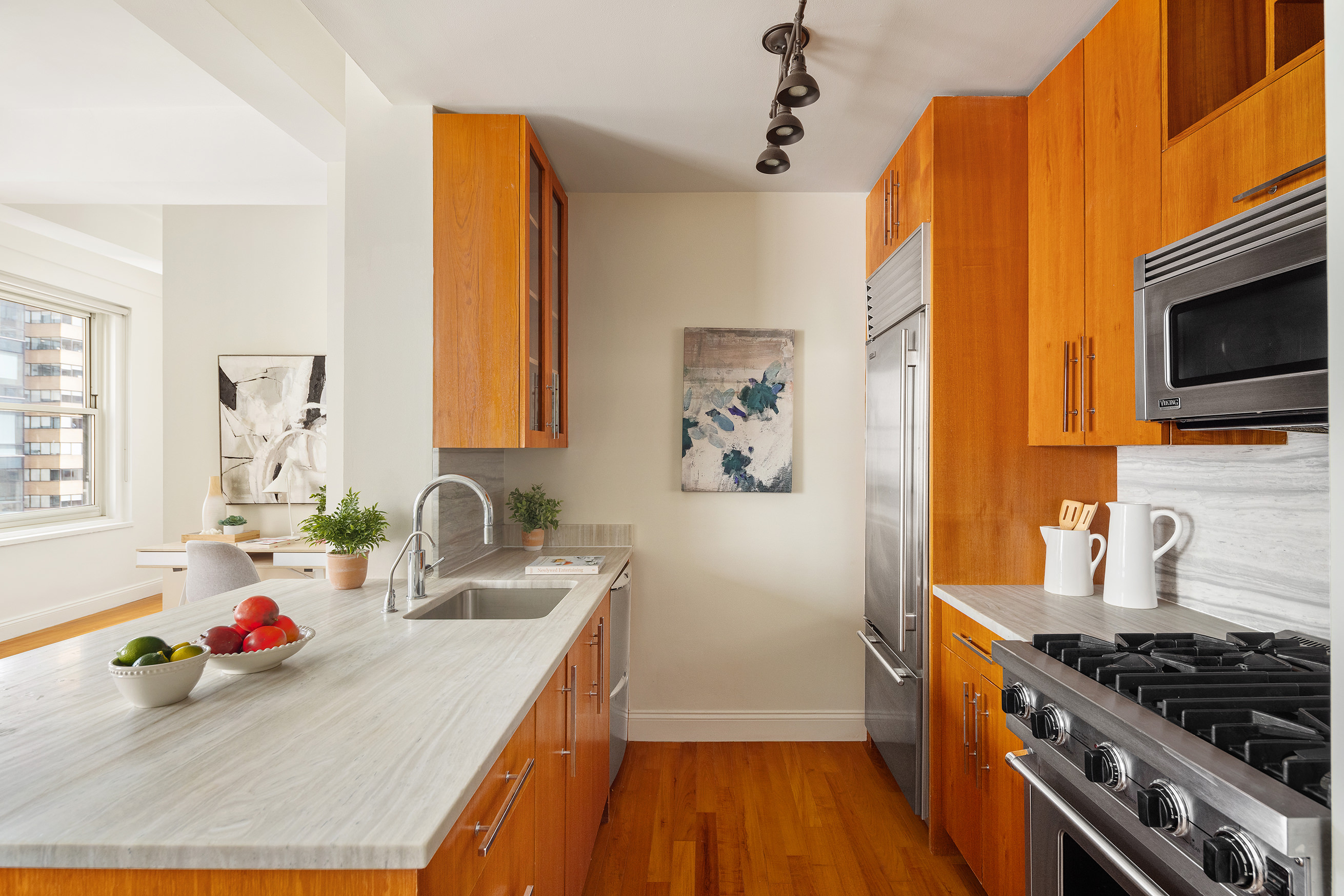 88 Greenwich Street, Unit 2206 Manhattan, NY 10006 - Photo 3 of 16 a kitchen that has a sink and a stove top oven