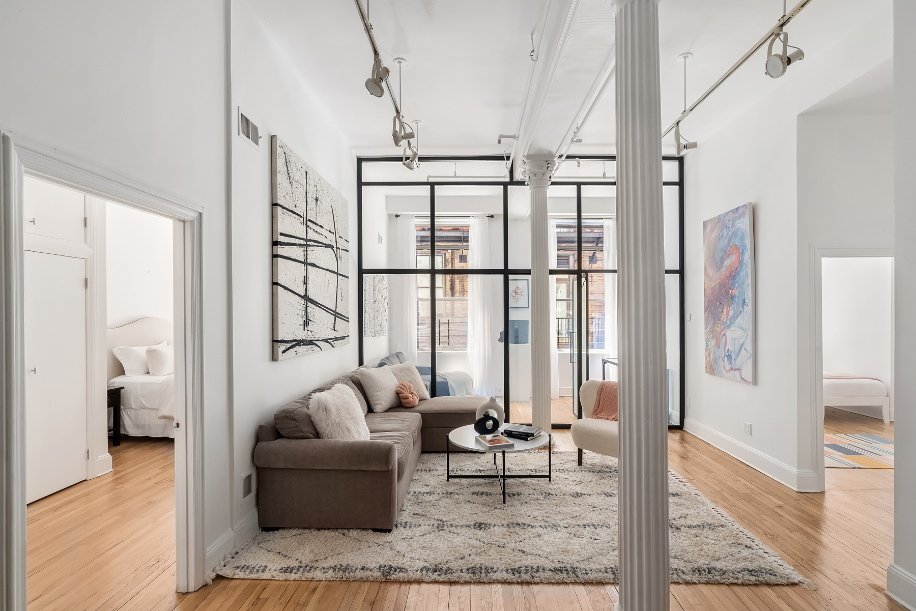 80 Leonard Street, Unit 3G Manhattan, NY 10013 - Photo 12 of 30 a living room with furniture and a window