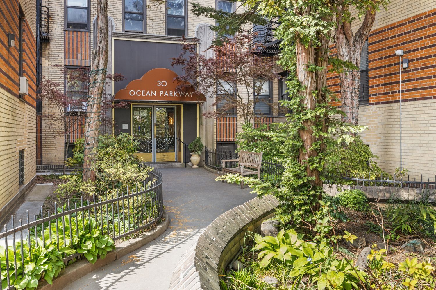 30 Ocean Parkway, Unit 6G Brooklyn, NY 11218 - Photo 14 of 18 front view of a house with a yard