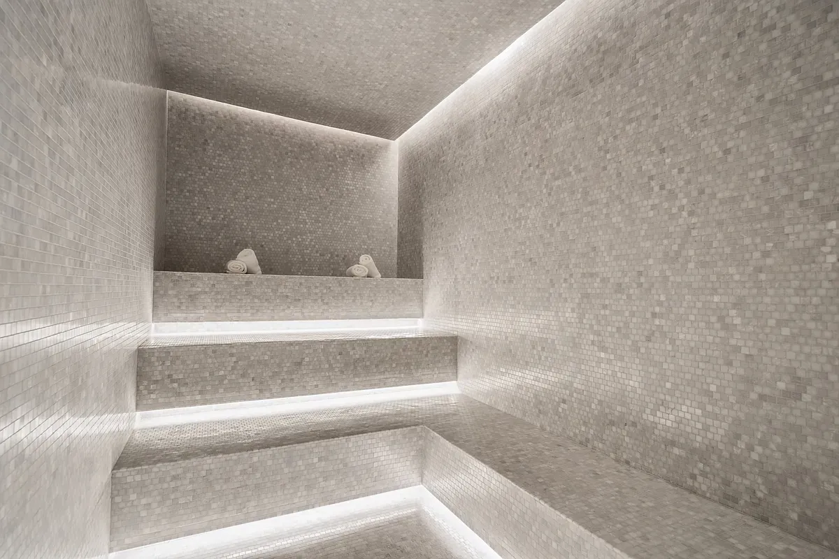 a view of a projector room with furniture and screen