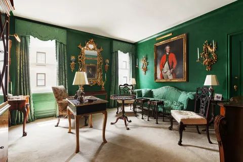 a view of a livingroom with furniture and window