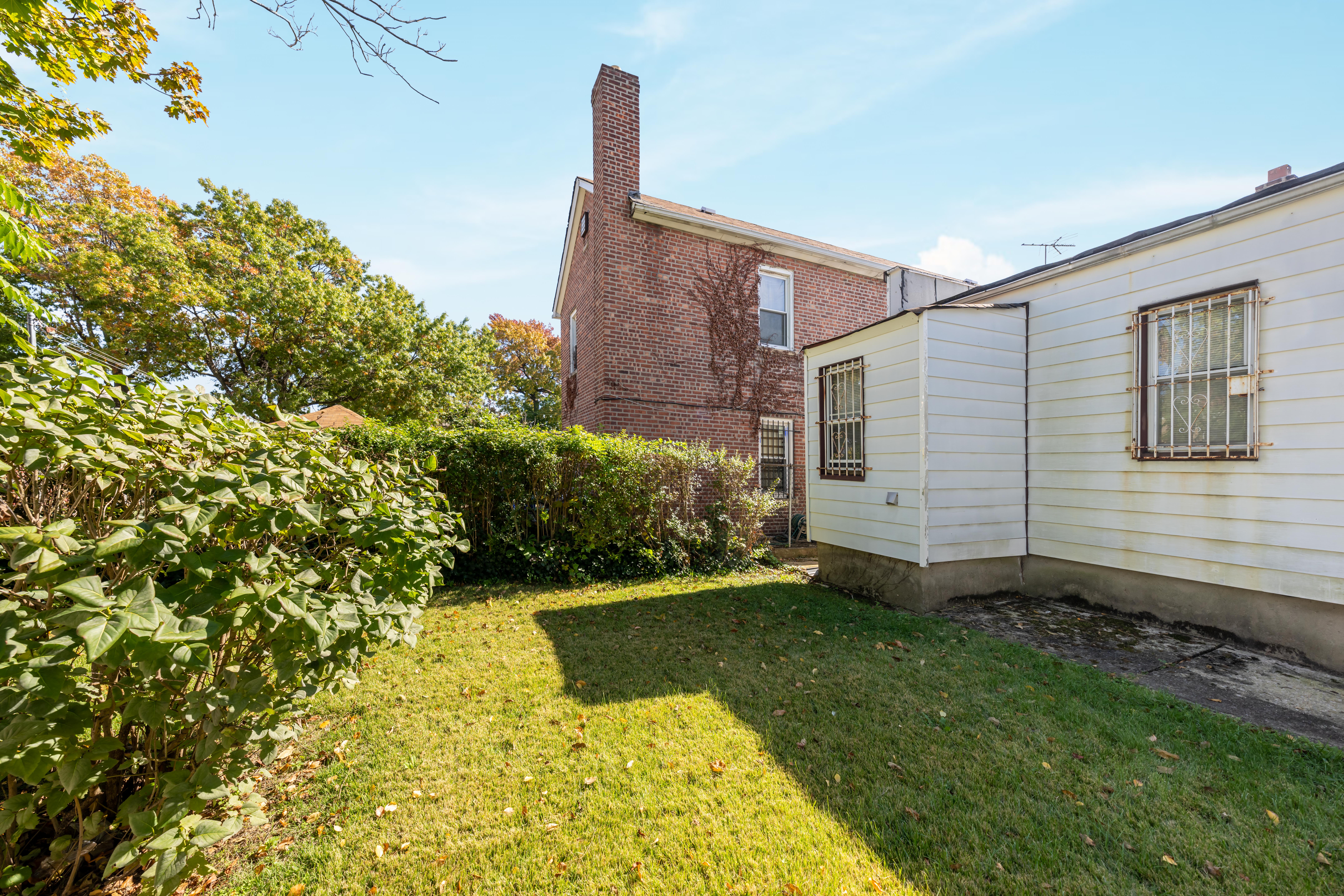 1085 Arnow Avenue Bronx, NY 10469 - Photo 15 of 16 a view of a backyard with plants