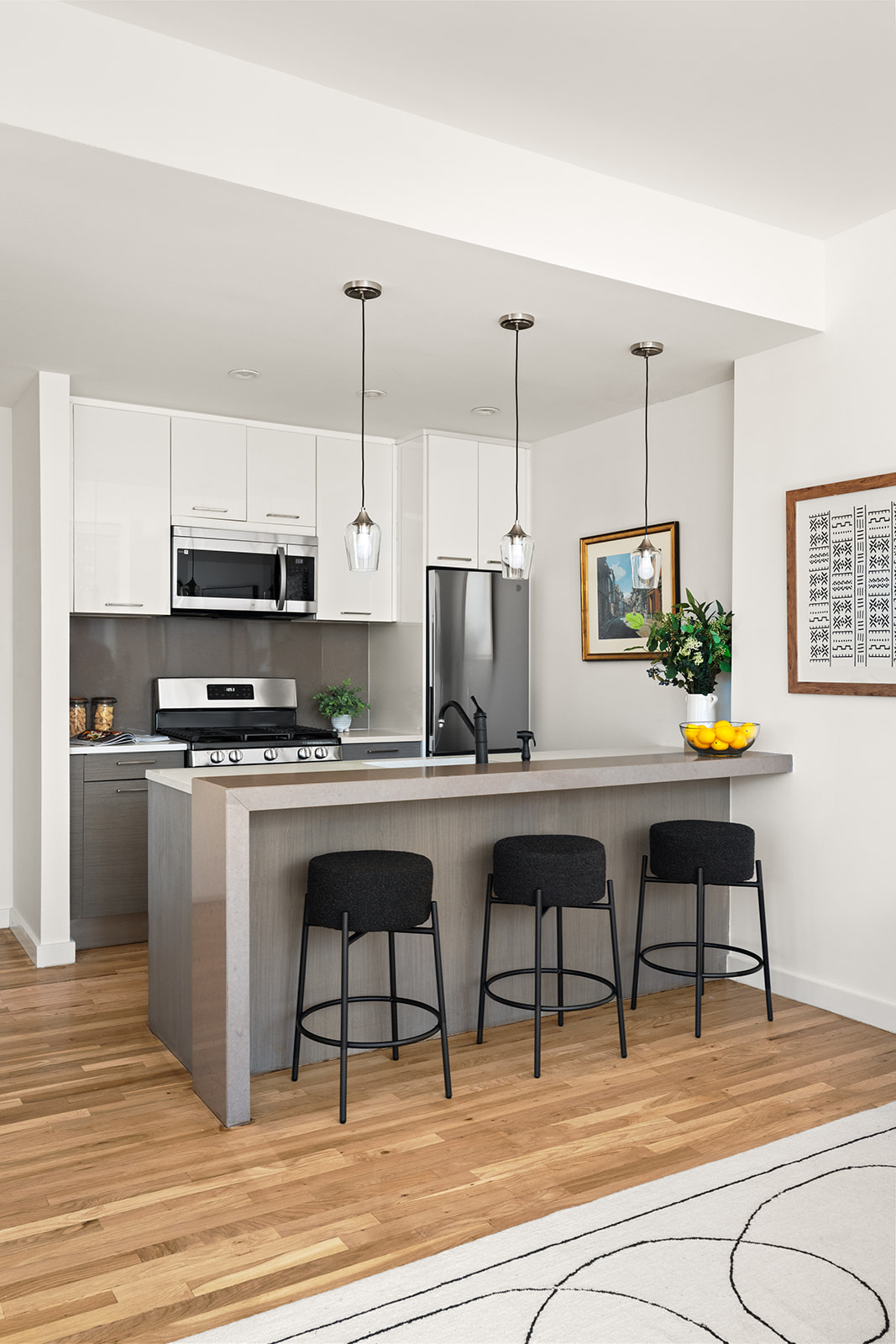 333 East 109th Street, Unit 7A Manhattan, NY 10029 - Photo 3 of 11 a kitchen with stainless steel appliances granite countertop a stove a sink and a refrigerator