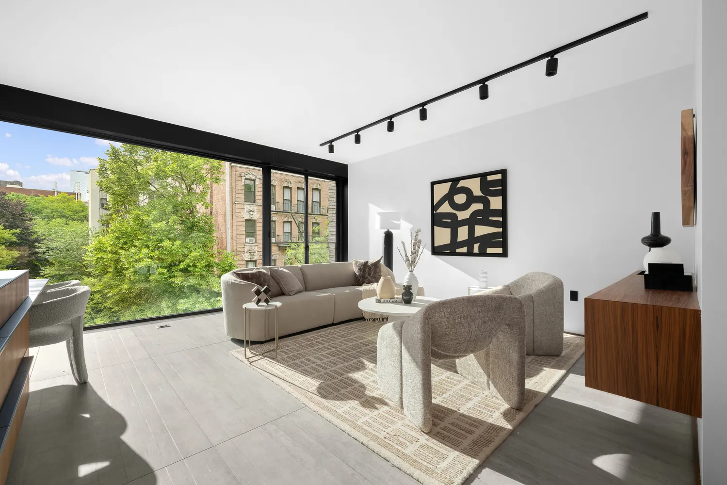 a living room with furniture and large windows