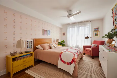 a bedroom with bed and a couch