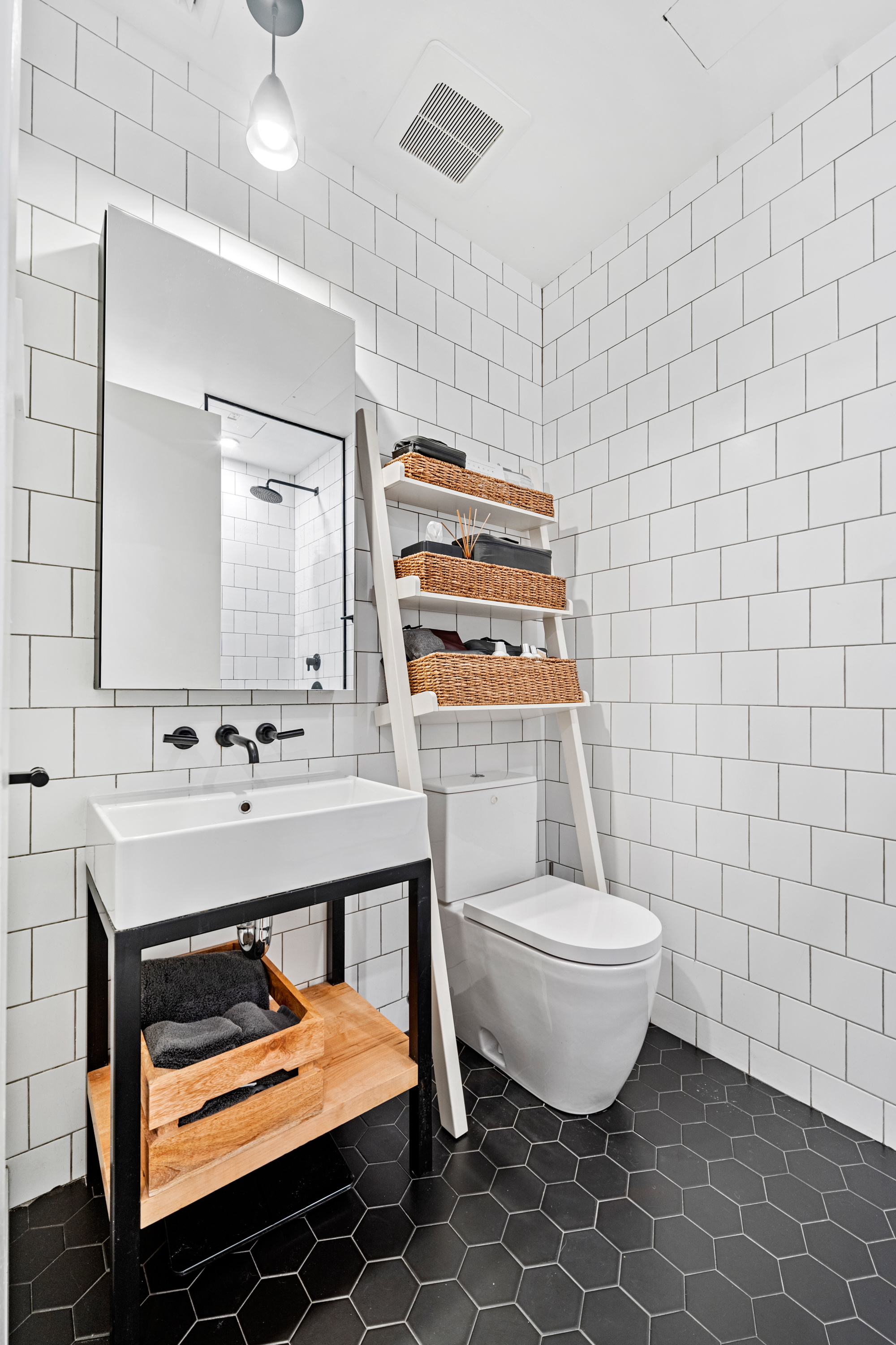 88 Lexington Avenue, Unit 1A Brooklyn, NY 11238 - Photo 6 of 13 a bathroom with a sink toilet and mirror