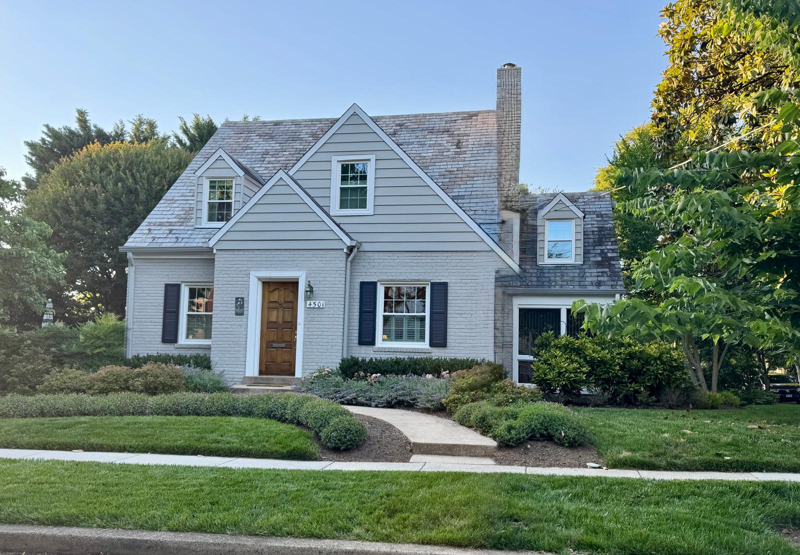4501 Garrison Street Northwest Washington, DC 20016 - Photo 1 of 2 a front view of a house with a yard