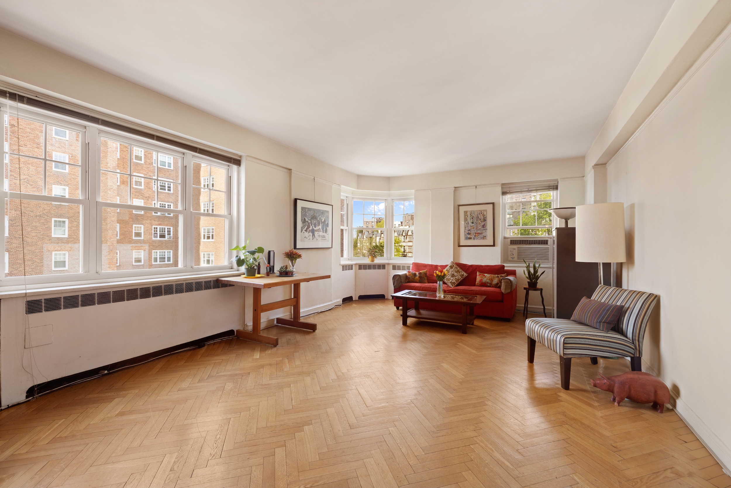 120 Cabrini Boulevard, Unit 76 Manhattan, NY 10033 - Photo 2 of 24 a living room with furniture and a window