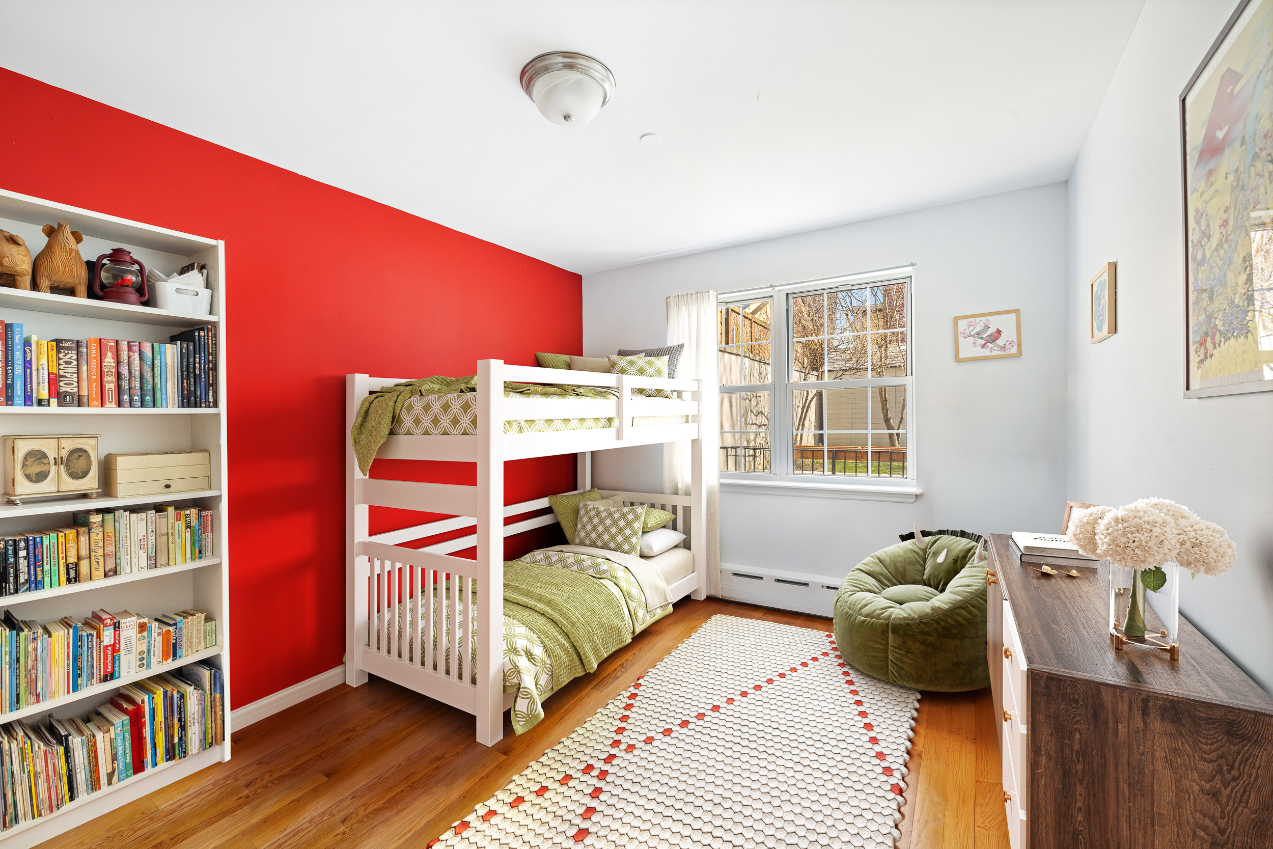26 Monitor Street, Unit 1 Brooklyn, NY 11222 - Photo 6 of 11 a bedroom with a bed and a book shelf