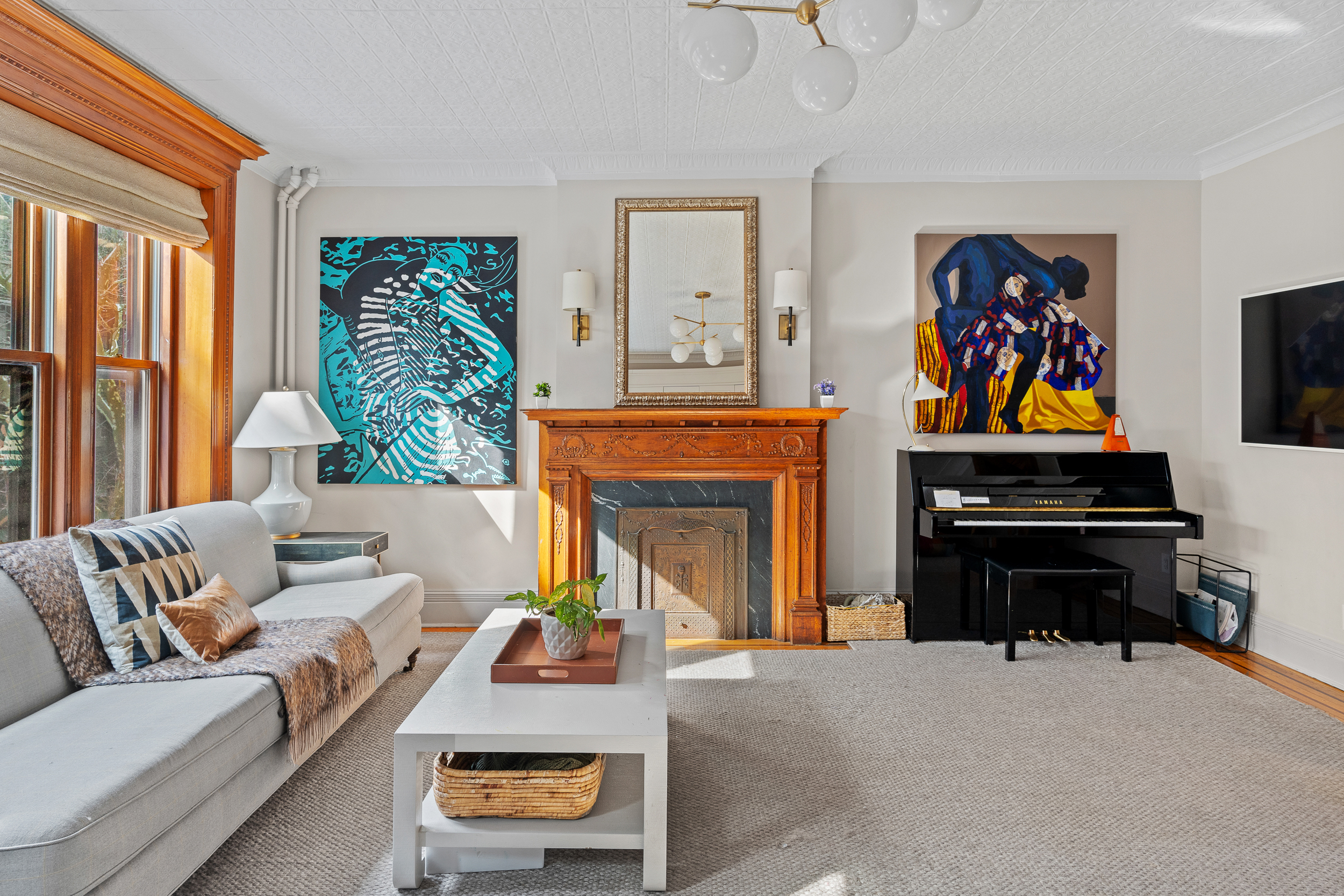 479 4th Street, Unit TRIPLEX Brooklyn, NY 11215 - Photo 7 of 17 a living room with furniture and a fireplace