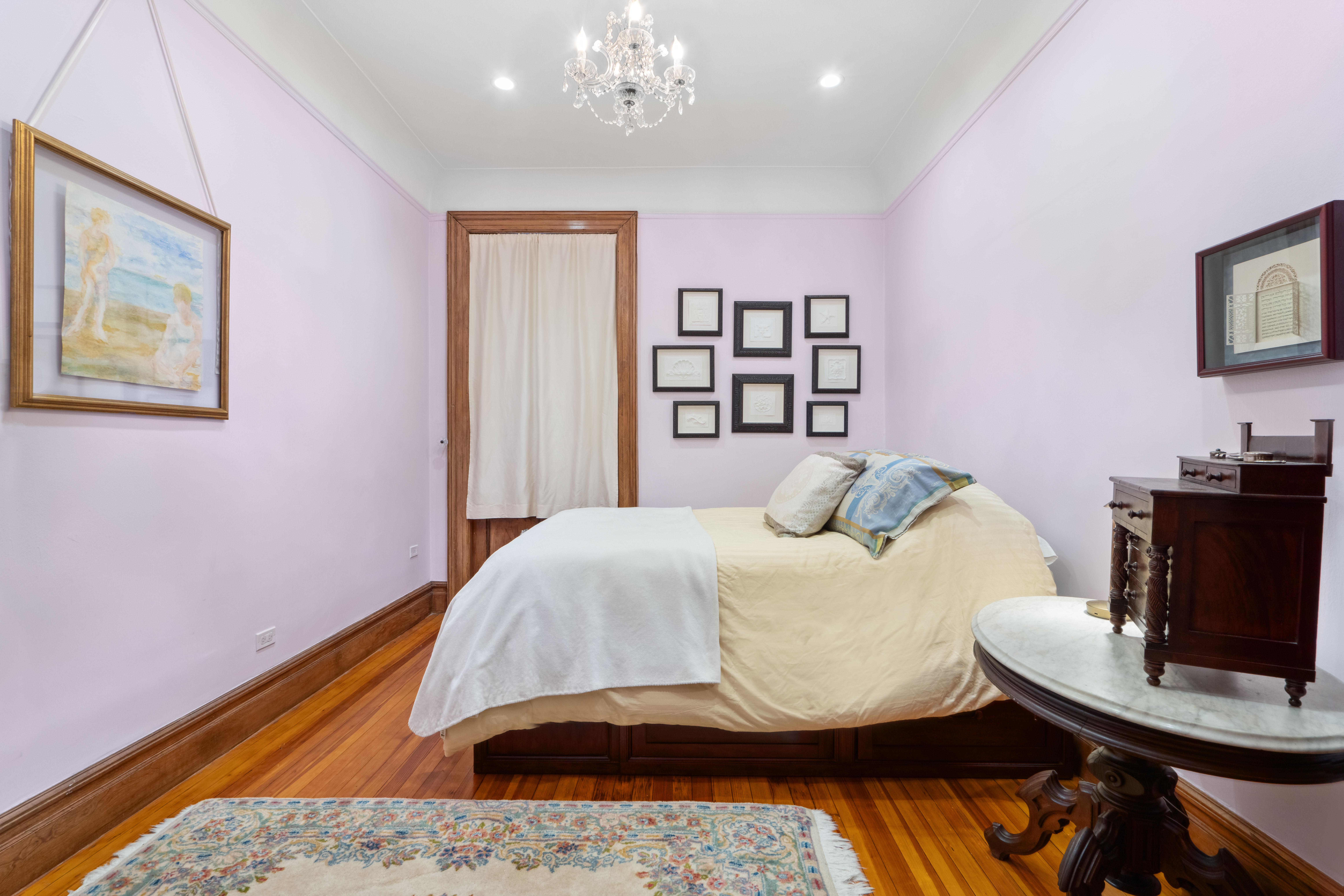 194 Riverside Drive, Unit 4B Manhattan, NY 10025 - Photo 7 of 17 a bedroom with a bed and wooden floor