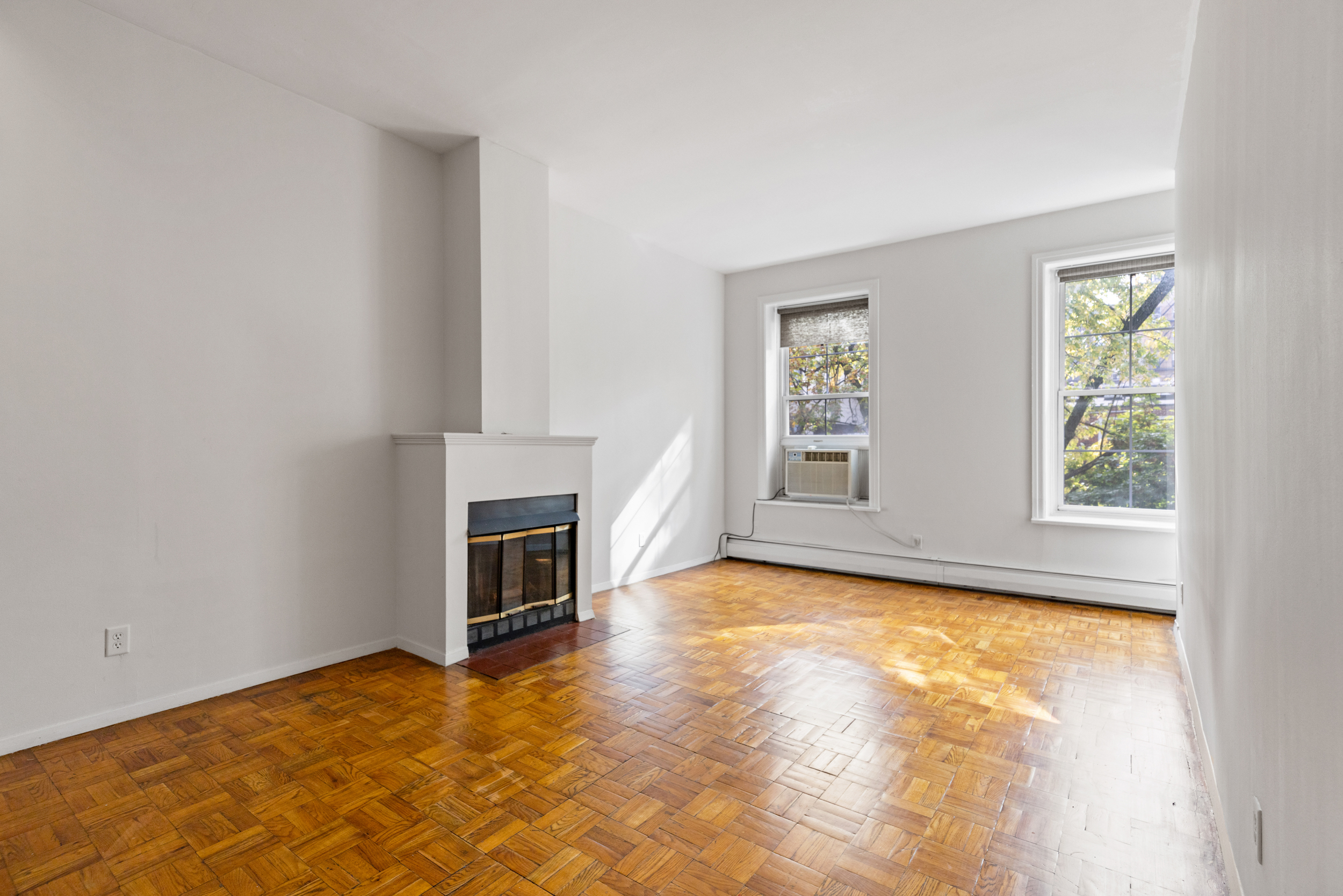 136 East 30th Street, Unit 3R Manhattan, NY 10016 - Photo 18 of 23 a view of a livingroom with a fireplace and window