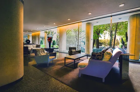 a room with pool table and a chandelier