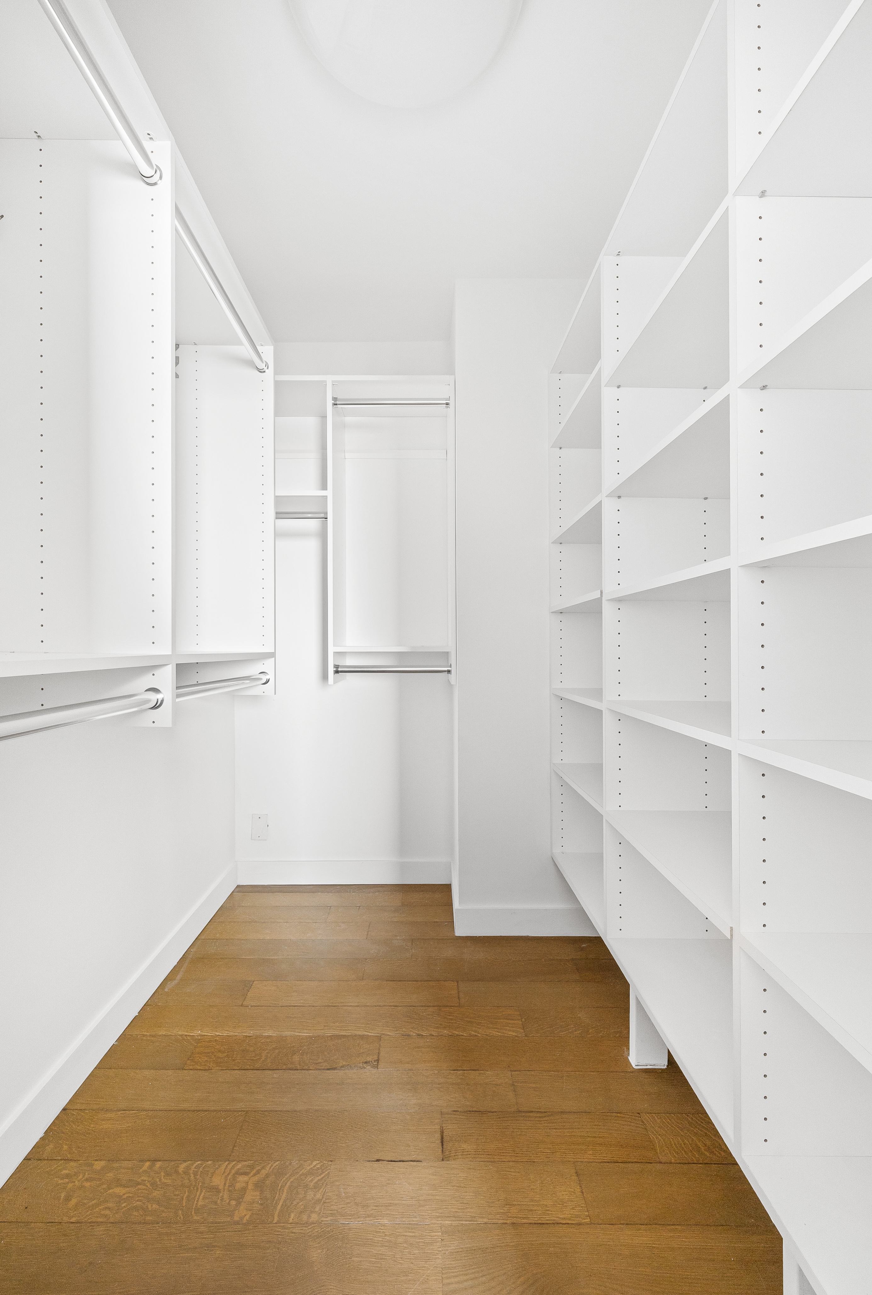 1623 3rd Avenue, Unit 36A Manhattan, NY 10128 - Photo 12 of 17 a view of an empty room with empty racks