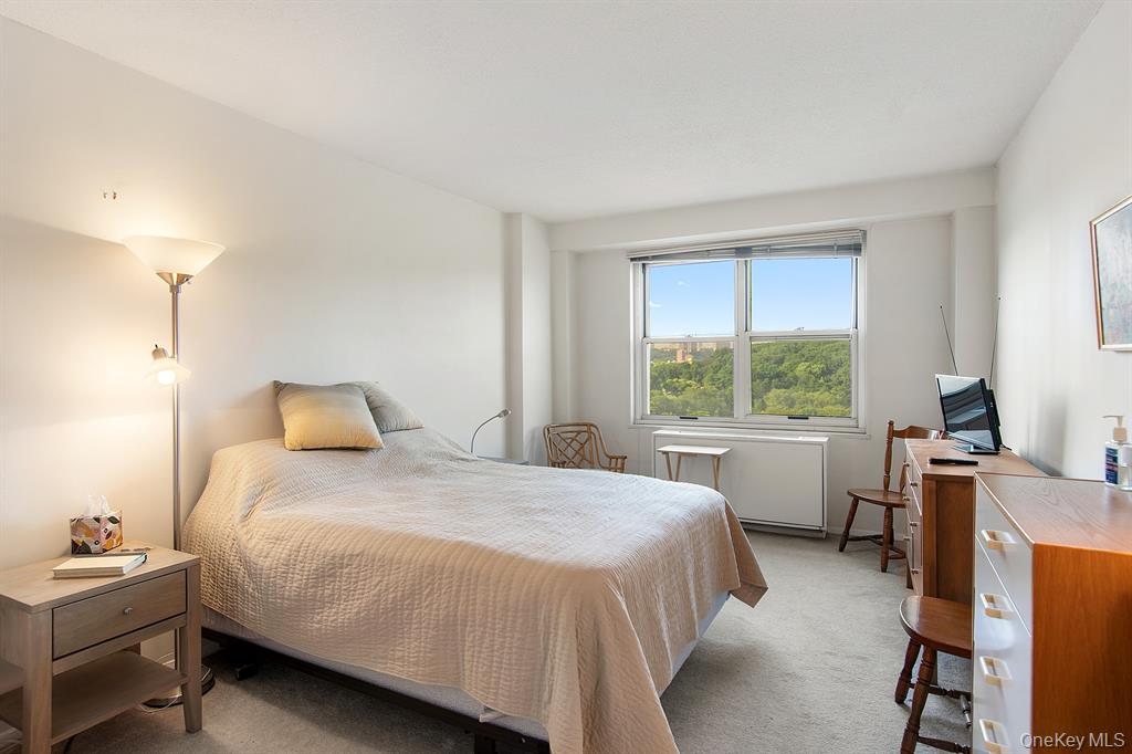 2400 Johnson Avenue, Unit 3B Bronx, NY 10463 - Photo 14 of 28 a bedroom with a bed and a desk