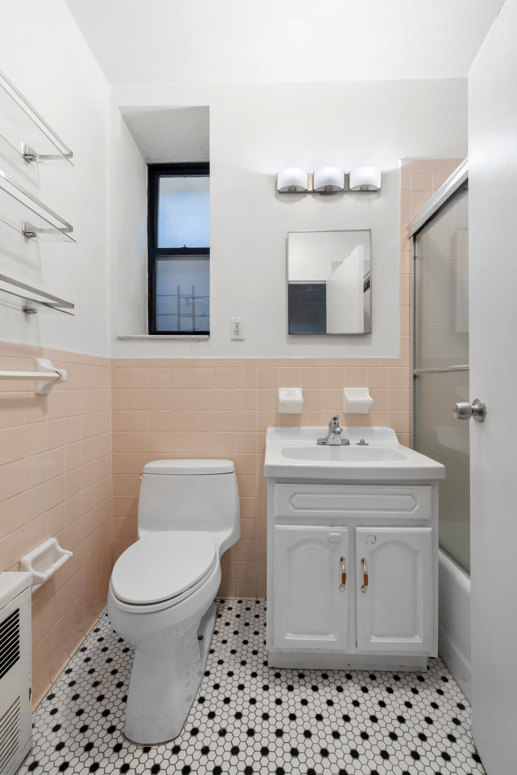 469 West 166th Street, Unit 2C Manhattan, NY 10032 - Photo 11 of 13 a bathroom with a sink toilet and mirror