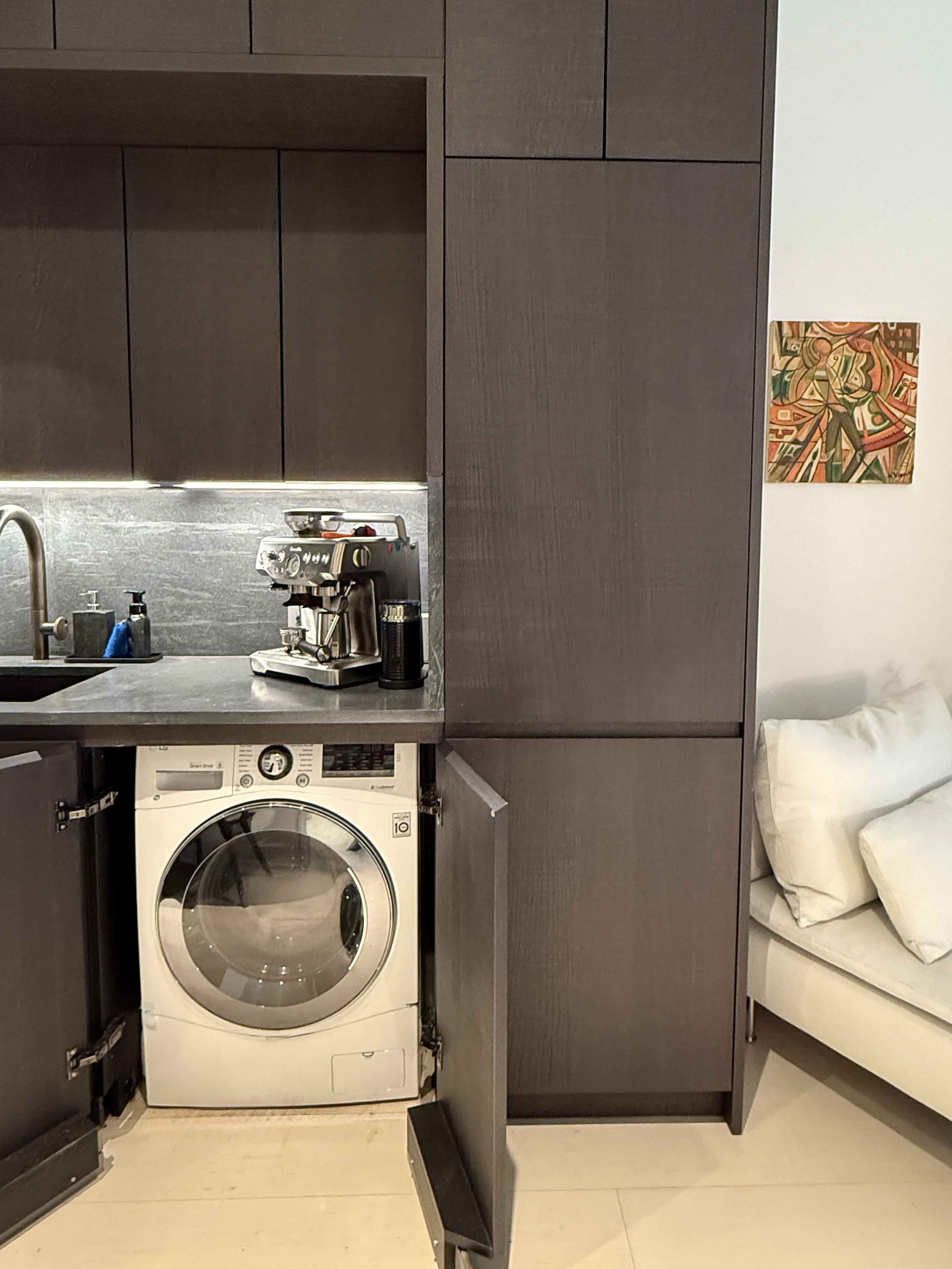 130 William Street, Unit 9E Manhattan, NY 10038 - Photo 12 of 16 a utility room with dryer and washer