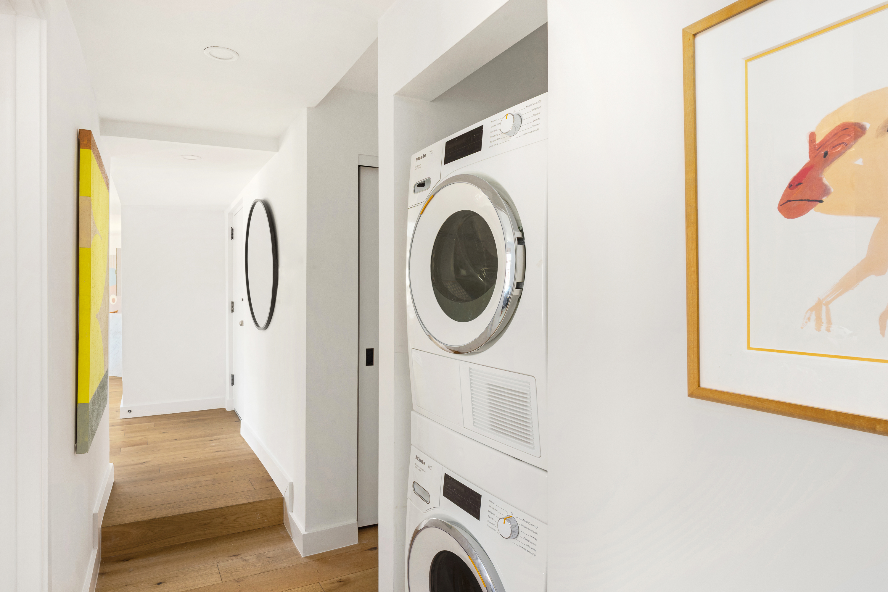 160 West 11th Street, Unit PH Manhattan, NY 10011 - Photo 15 of 16 a view of a hallway with washer and dryer