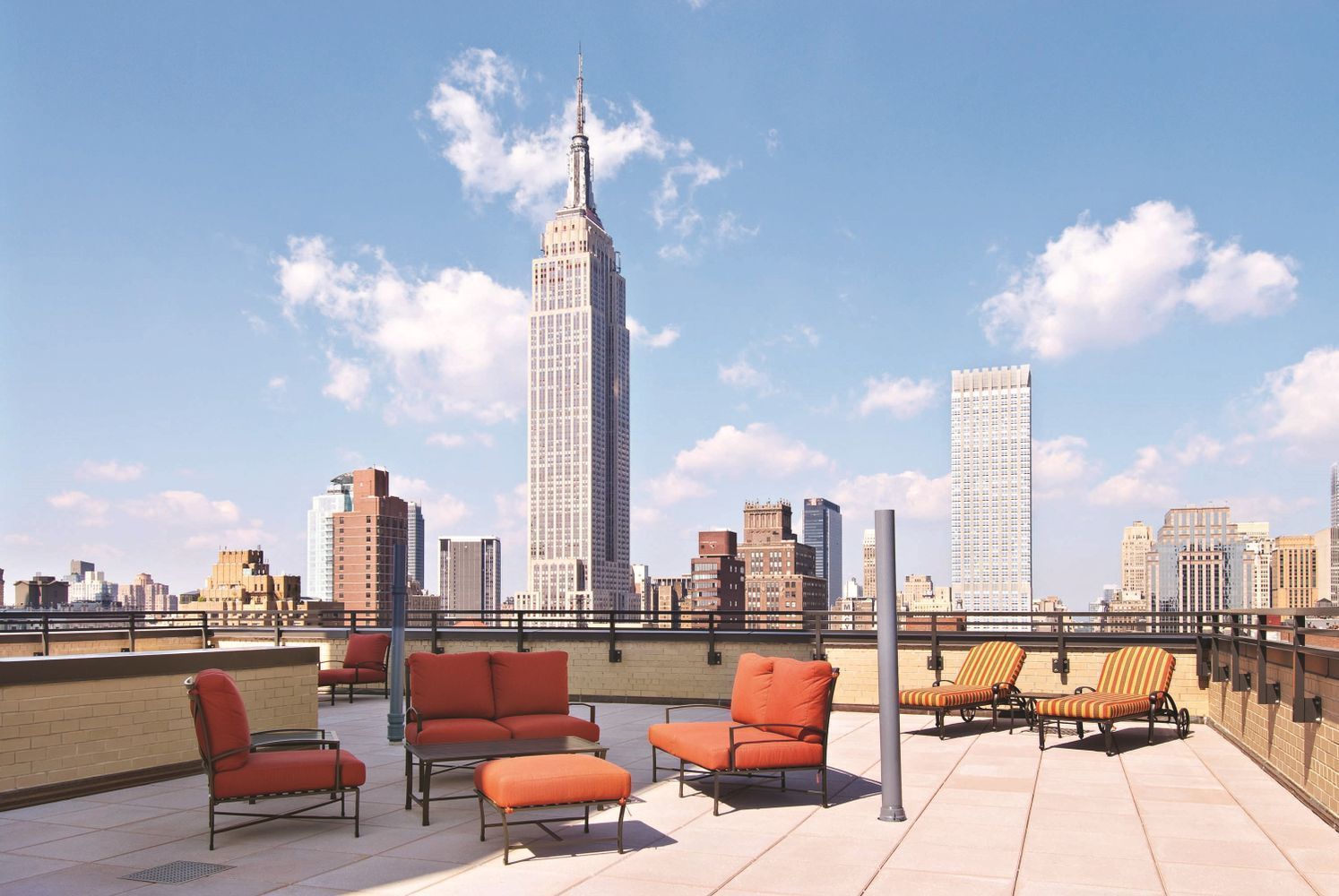 137 East 36th Street, Unit 12G Manhattan, NY 10016 - Photo 13 of 15 a terrace with outdoor seating and city view