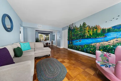 a living room with furniture and a garden