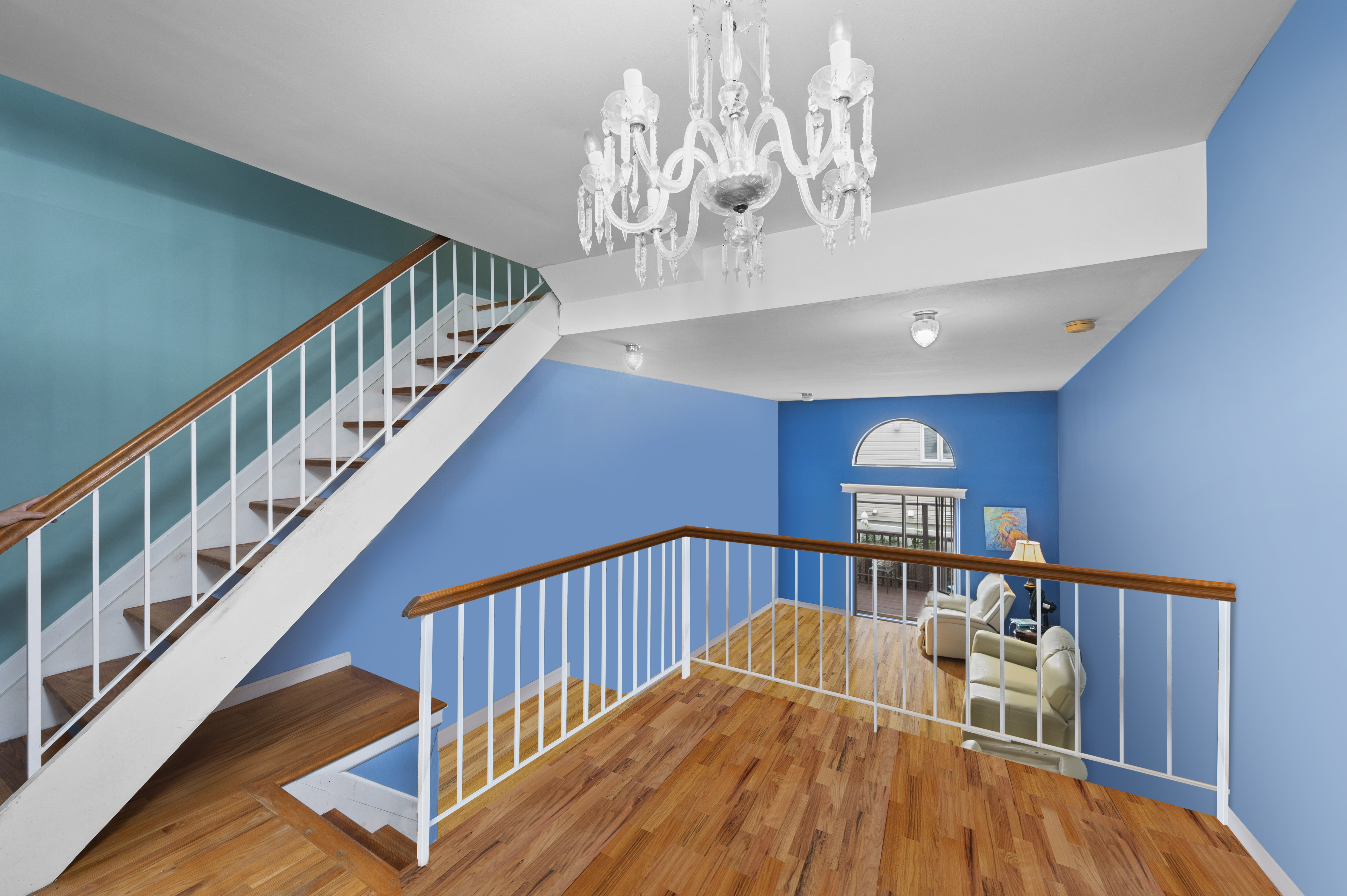 20 Eric Lane Staten Island, NY 10308 - Photo 8 of 20 a view of staircase with lots of frames on wall and wooden floor