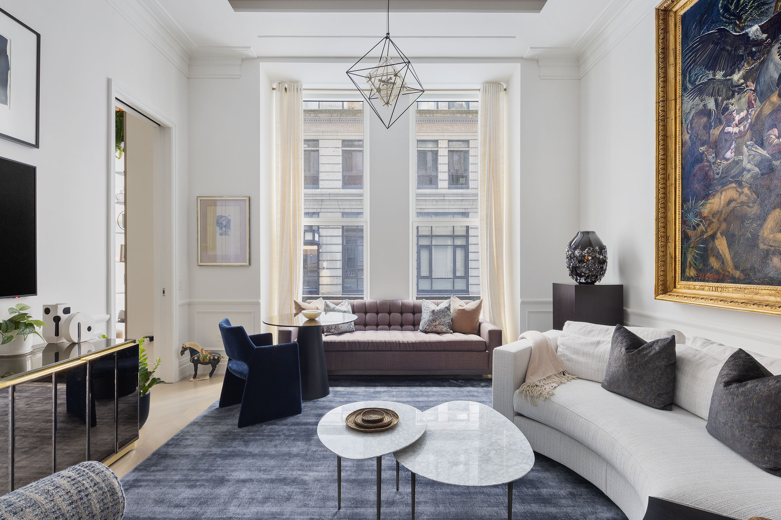 108 Leonard Street, Unit 2A Manhattan, NY 10013 - Photo 7 of 7 a living room with furniture and a chandelier