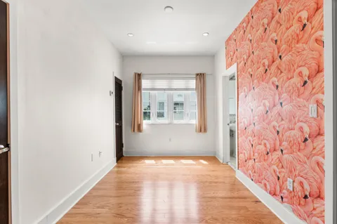 a view of an empty room with a window