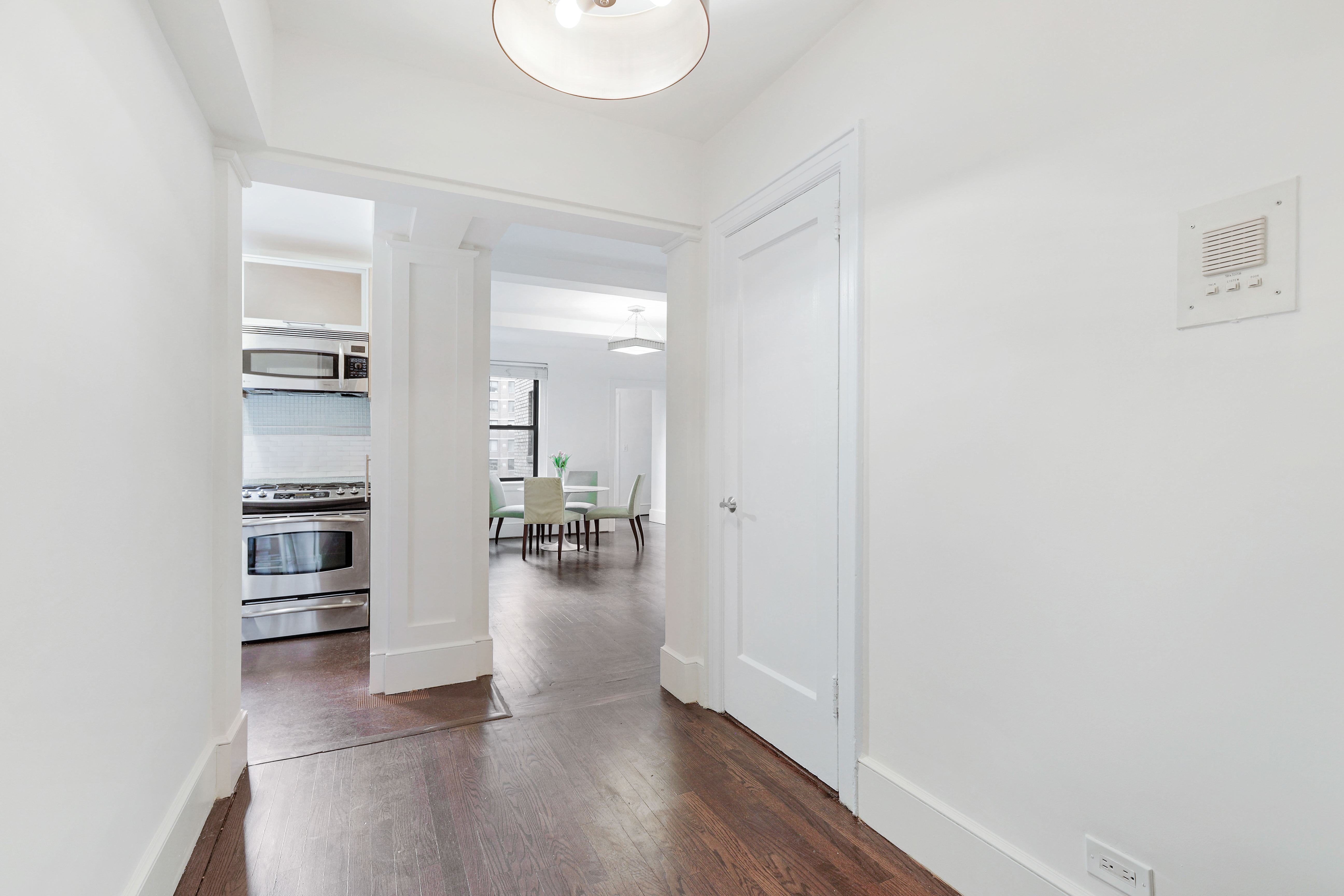 65 West 95th Street, Unit 4D Manhattan, NY 10025 - Photo 5 of 11 wooden floor in kitchen and a room with a sink