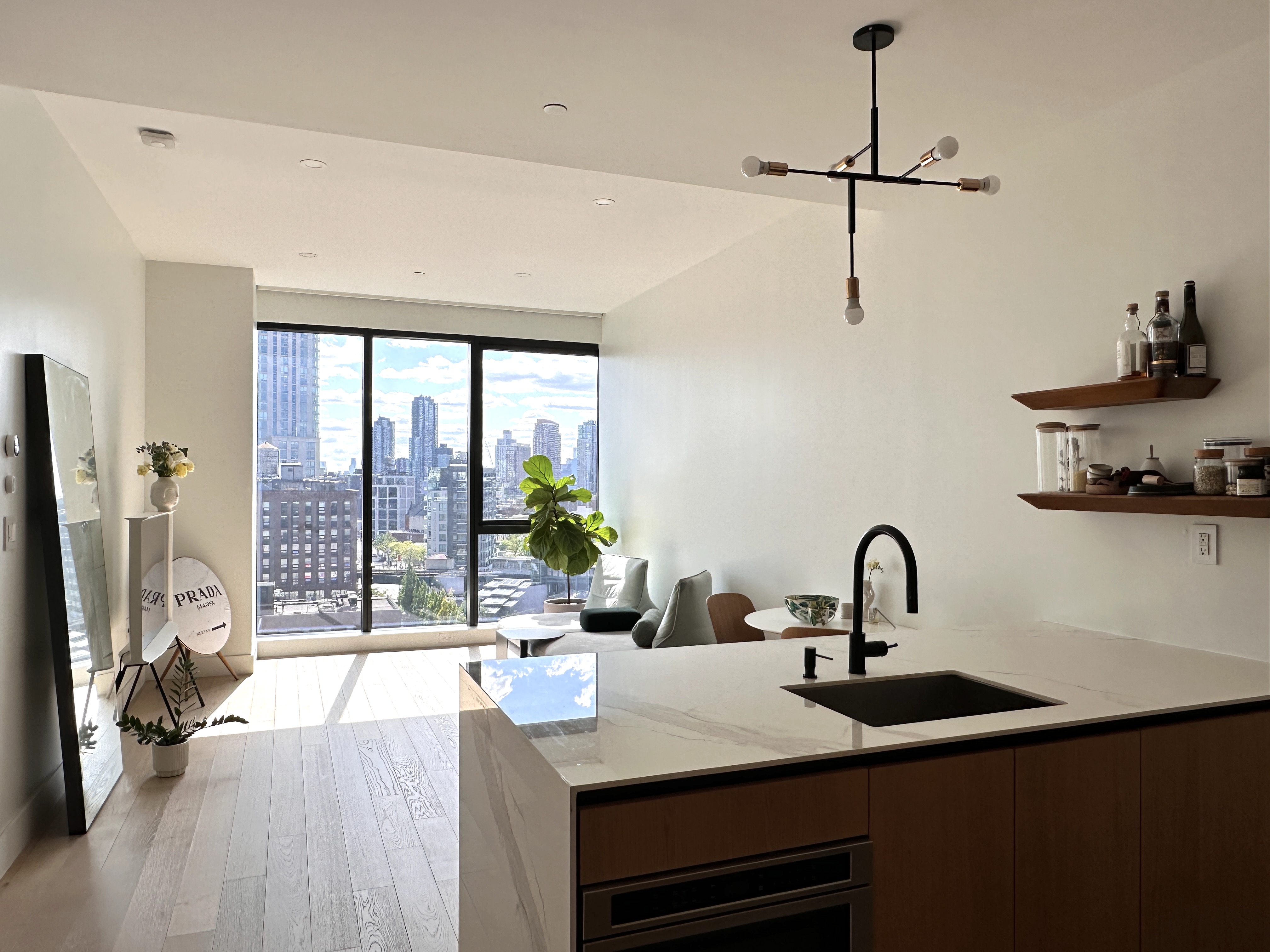 4507 Court Square West, Unit 10E Queens, NY 11101 - Photo 5 of 14 a kitchen with a sink a counter and appliances