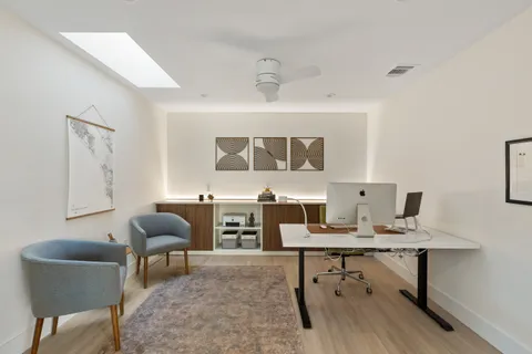 a workspace with furniture and a window