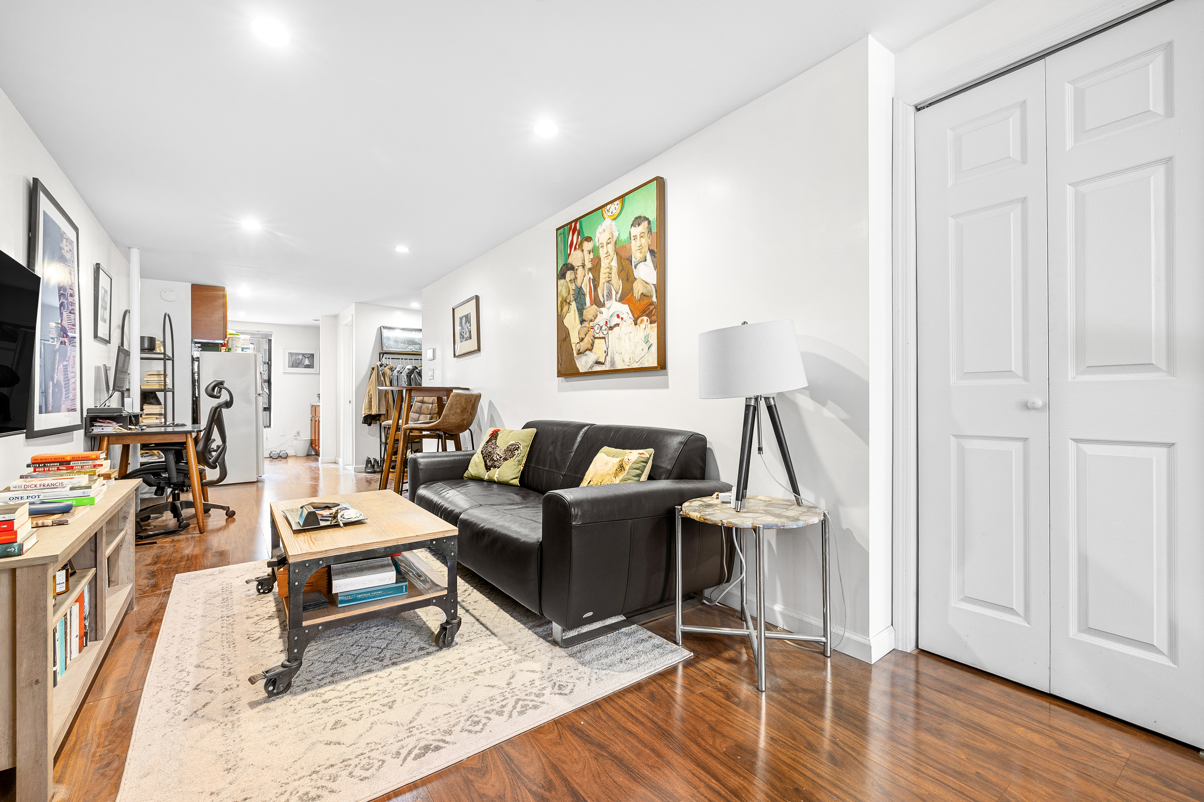 82 East 7th Street, Unit 2 Manhattan, NY 10003 - Photo 7 of 11 a living room with furniture and a wooden floor