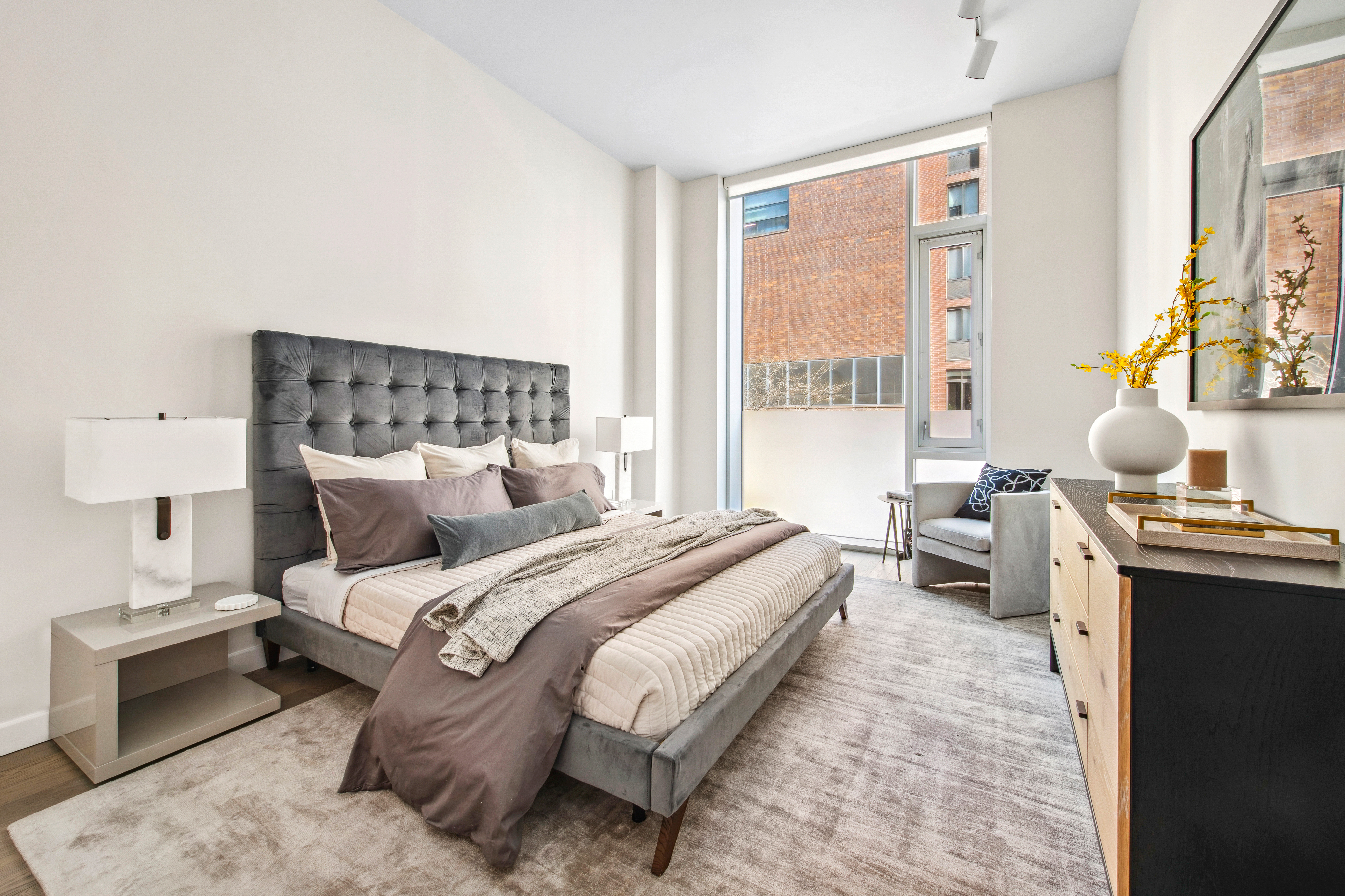505-513 West 43rd Street, Unit 2B Manhattan, NY 10036 - Photo 5 of 18 a spacious bedroom with a bed and a window