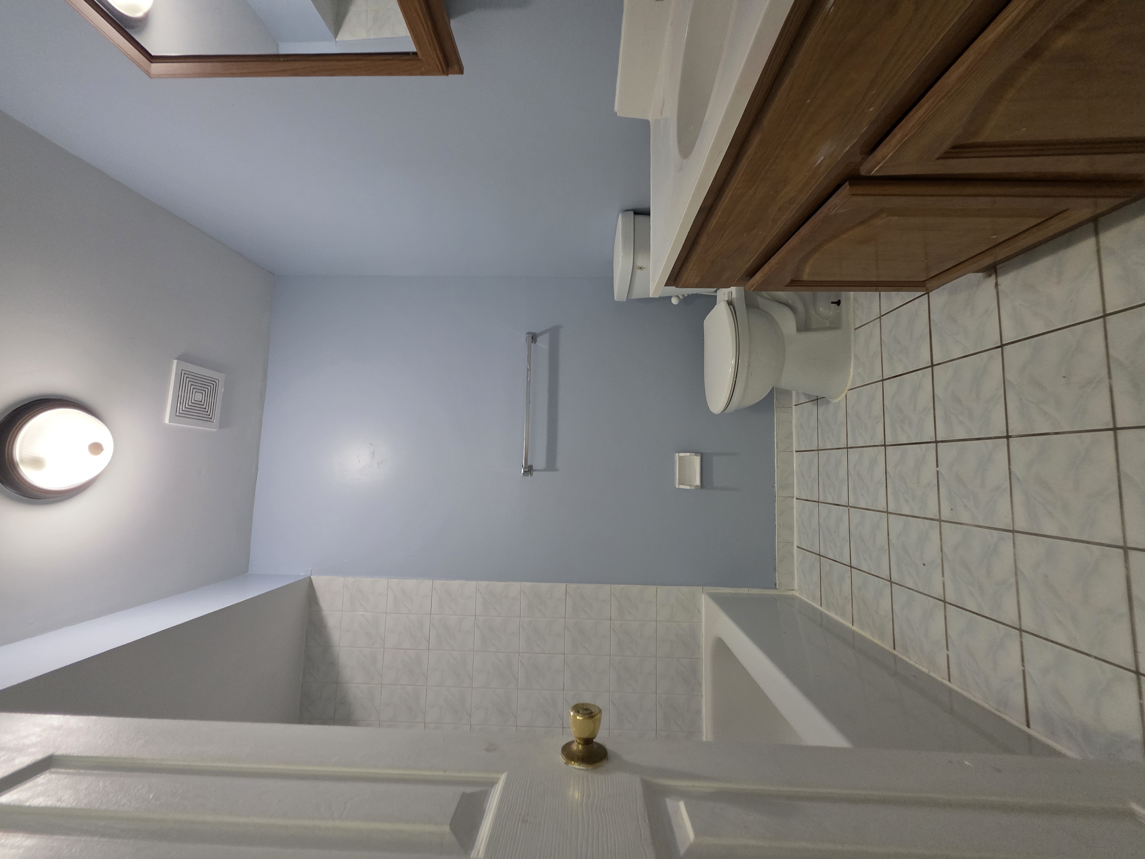 216 Pond Way, Unit 1 Staten Island, NY 10303 - Photo 7 of 9 a bathroom with a granite countertop sink a toilet and bathtub