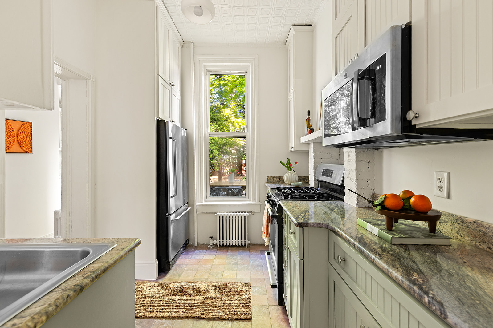 467 11th Street Brooklyn, NY 11215 - Photo 4 of 14 a kitchen with stainless steel appliances granite countertop a sink stove and refrigerator