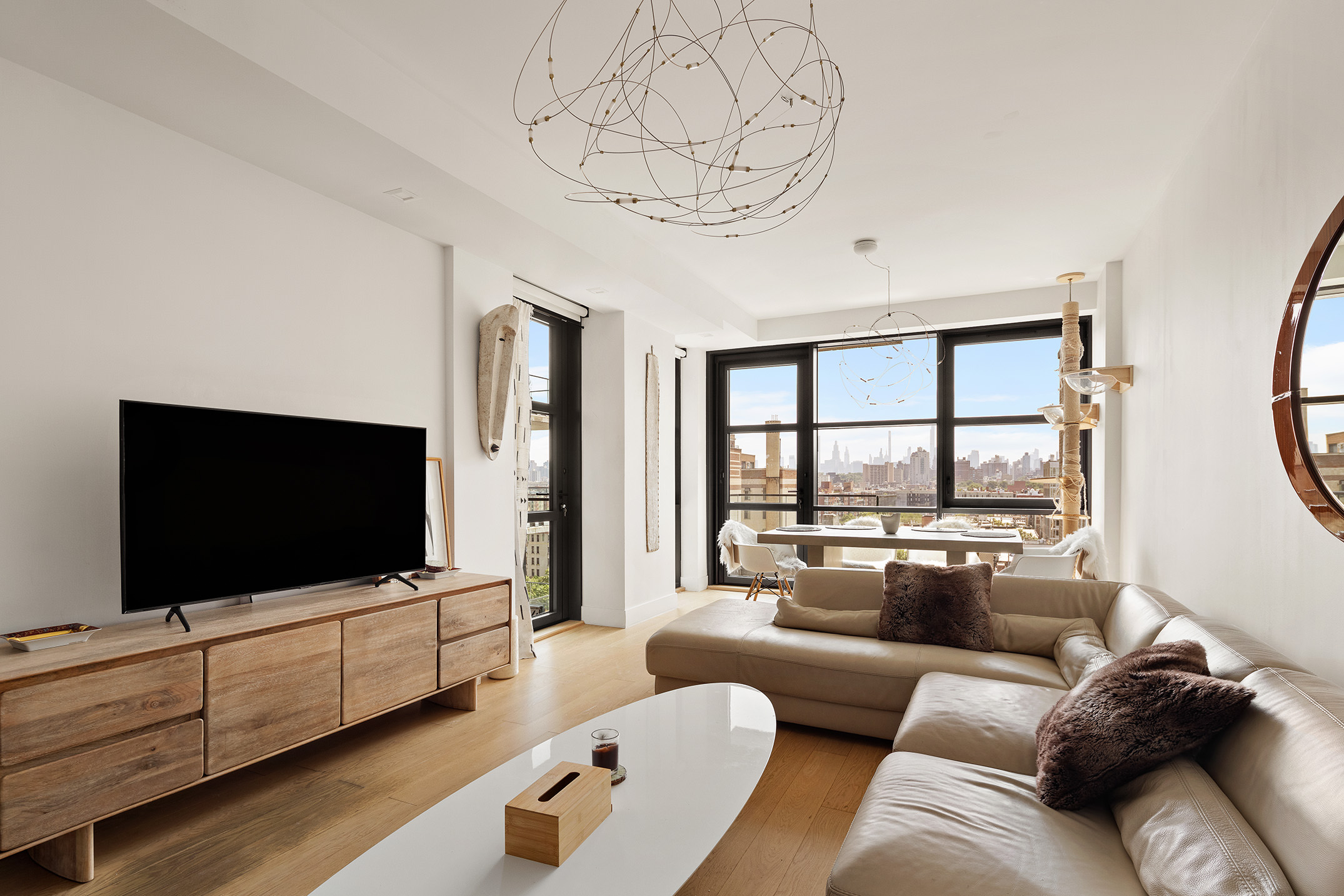 11 Hancock Place, Unit PH102 Manhattan, NY 10027 - Photo 1 of 18 a living room with furniture and a flat screen tv