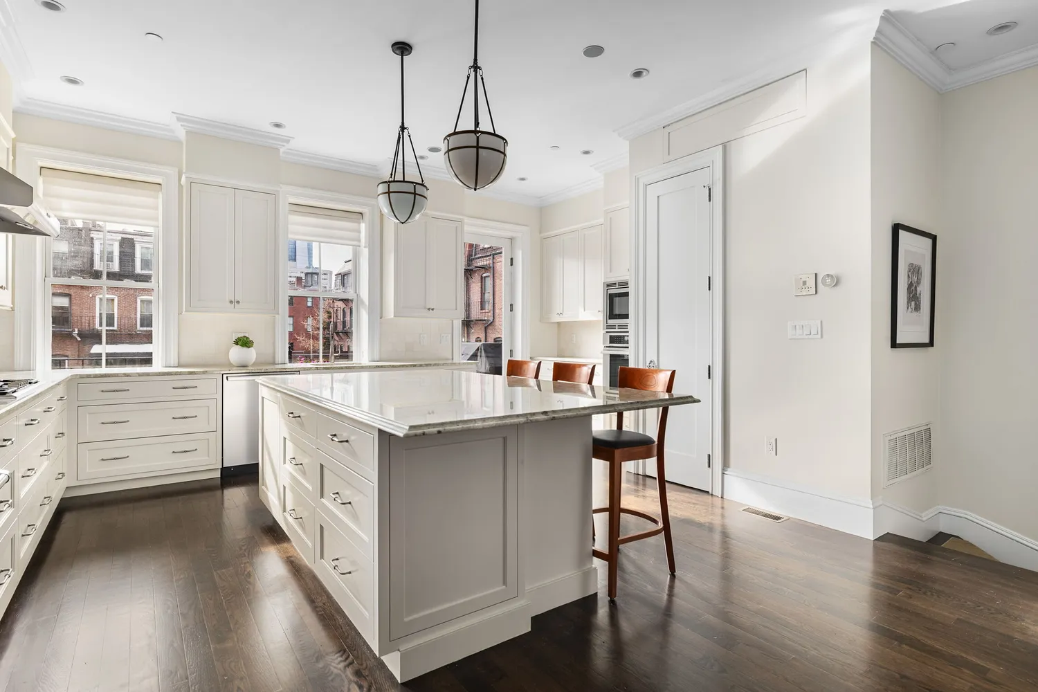 a kitchen with stainless steel appliances kitchen island granite countertop a stove a sink and a refrigerator
