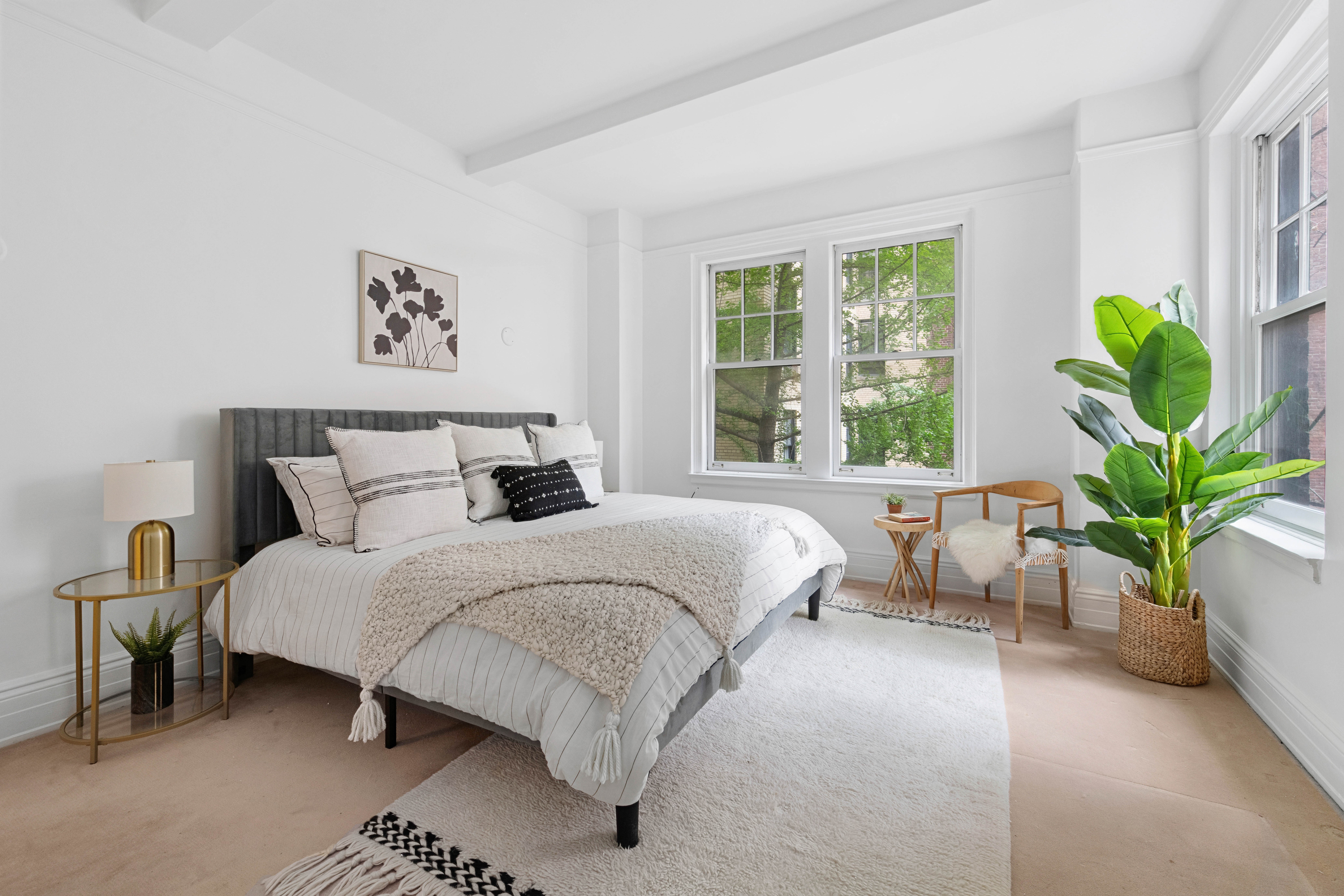 444 East 57th Street, Unit 5C Manhattan, NY 10022 - Photo 4 of 13 a bedroom with bed and a potted plant