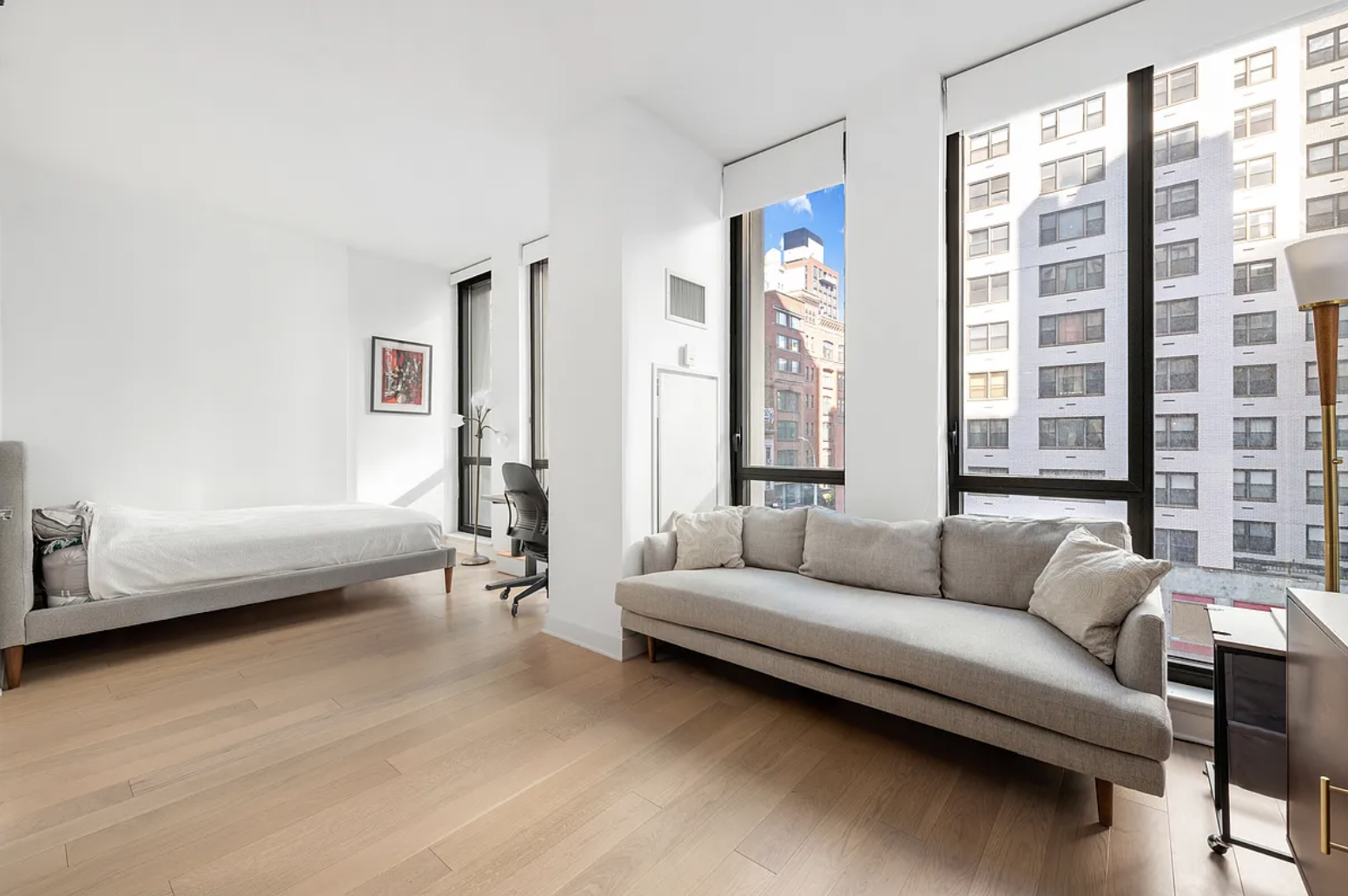 160 East 22nd Street, Unit 4D Manhattan, NY 10010 - Photo 4 of 15 a living room with furniture and a large window