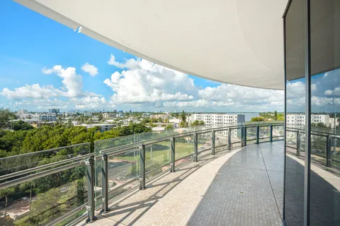 a view of a balcony with chairs