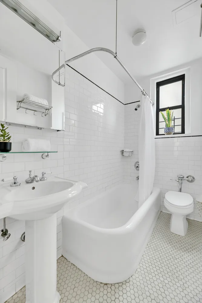 a bathroom with a sink a toilet and a bathtub