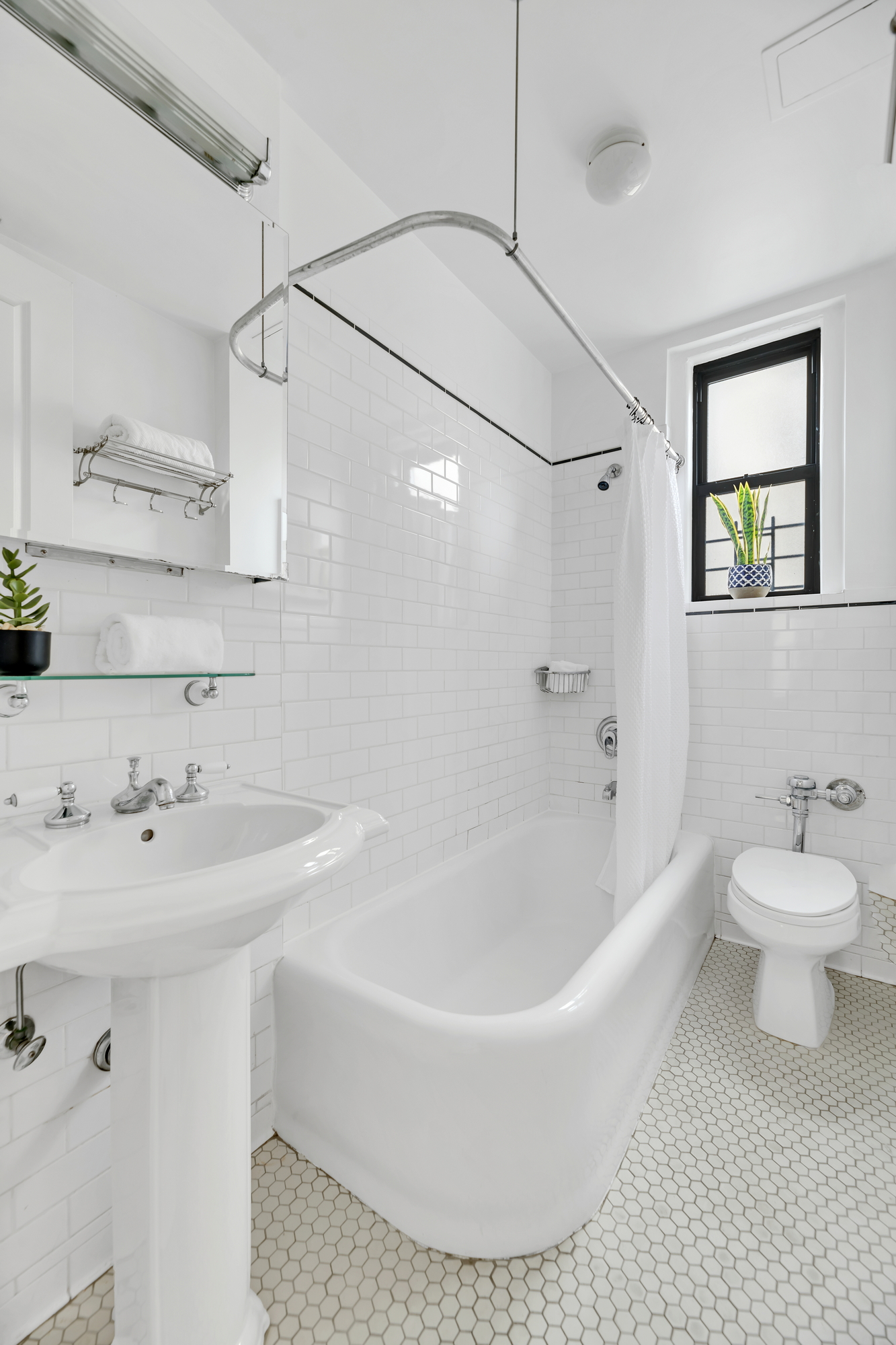 599 West End Avenue, Unit 7BC Manhattan, NY 10024 - Photo 7 of 11 a bathroom with a sink a toilet and a bathtub
